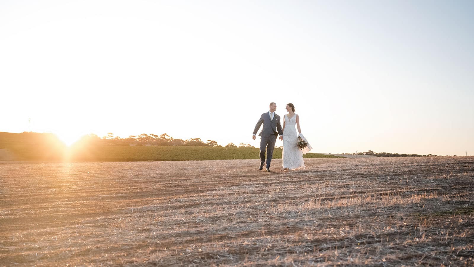 white hill estate wedding - catherine & sean 315 Bride and groom walking in open field