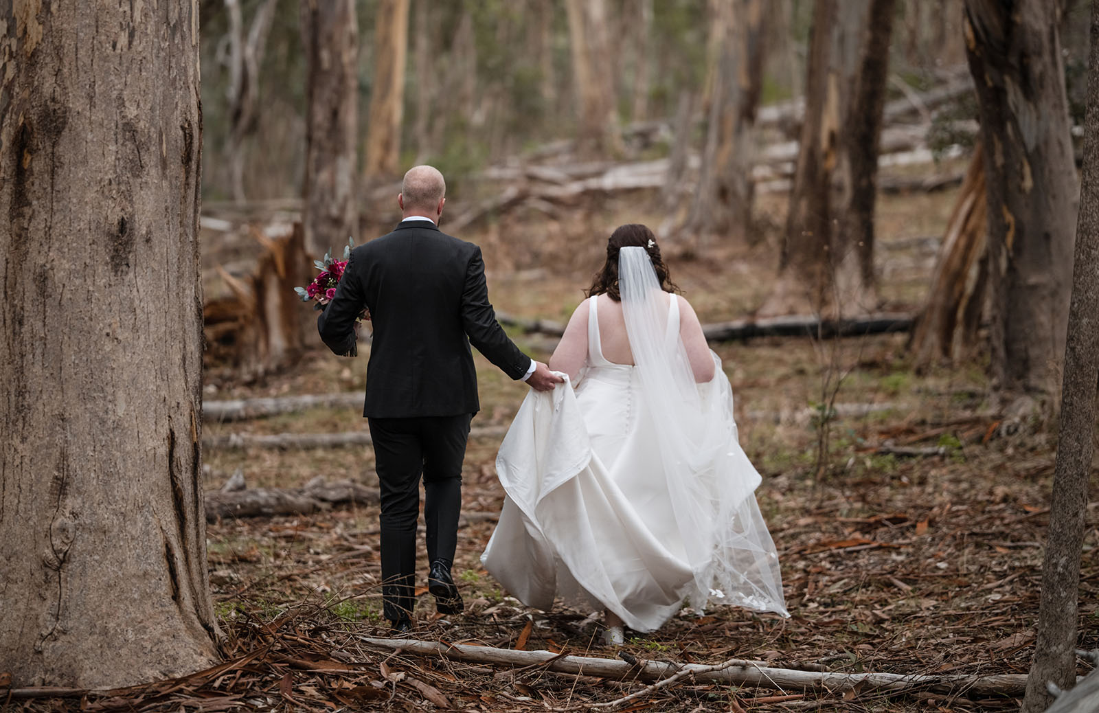 ten22 wedding - julia & daniel 163 Bride and groom walking through gum forest