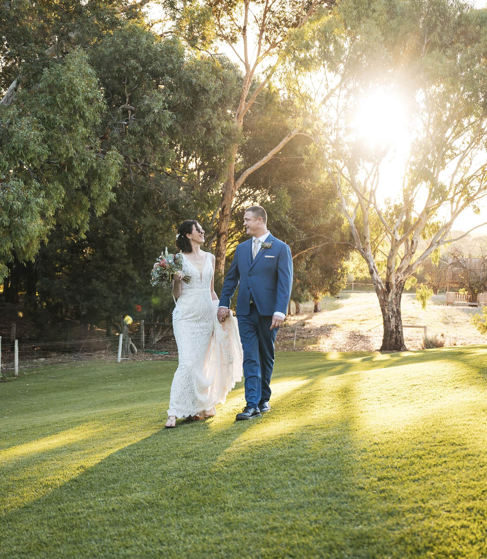 white hill estate wedding - catherine & sean 308 Bride and groom walking together under the sun