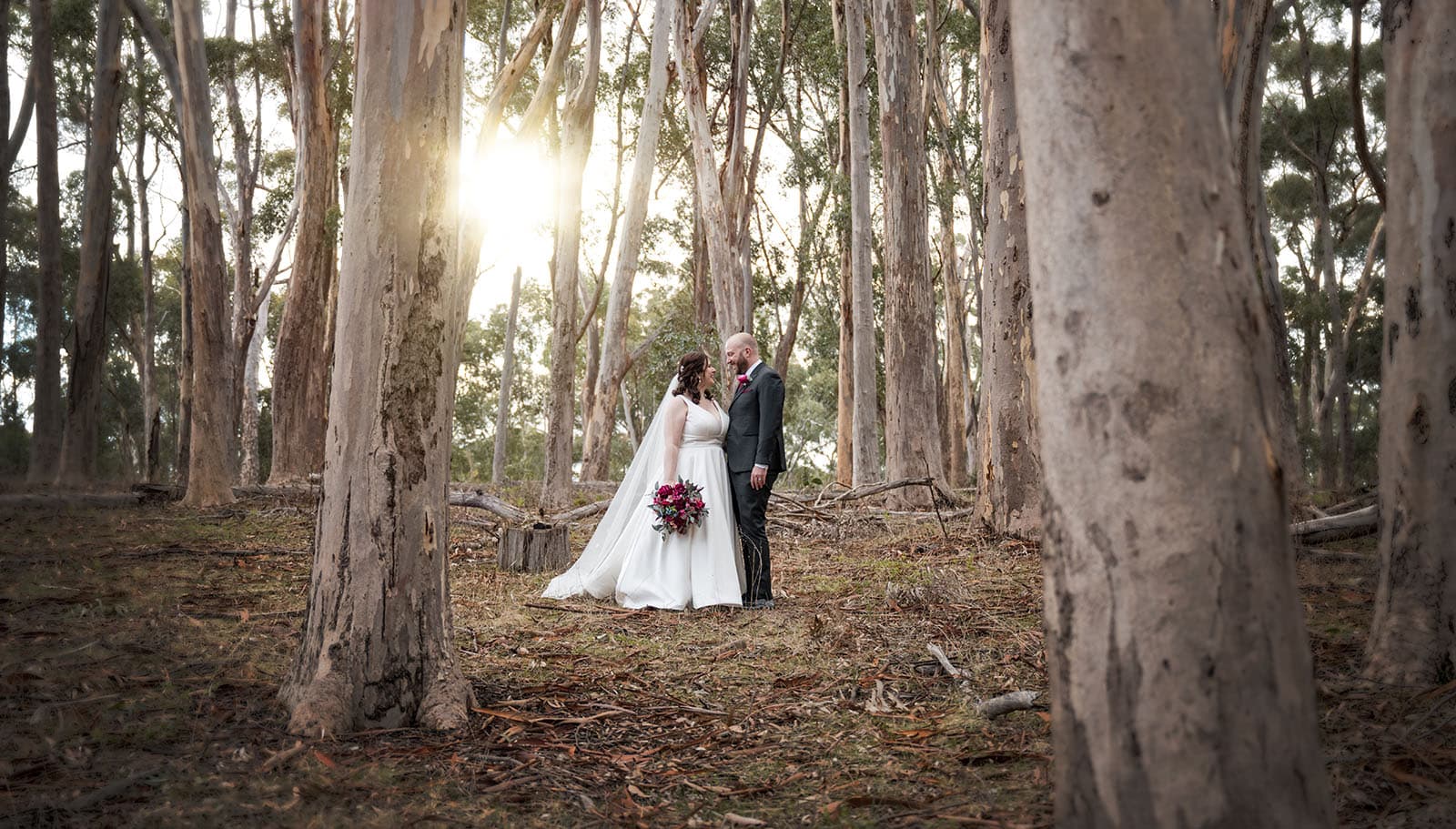 ten22 wedding - julia & daniel 165 Bride and groom with sunlight through gum trees