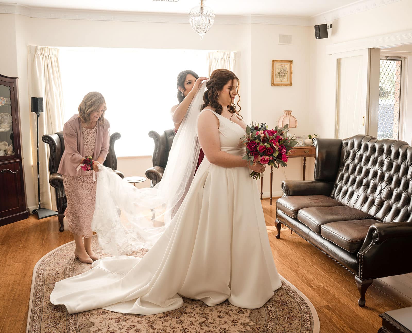 ten22 wedding - julia & daniel 148 Bride having dress fussed over