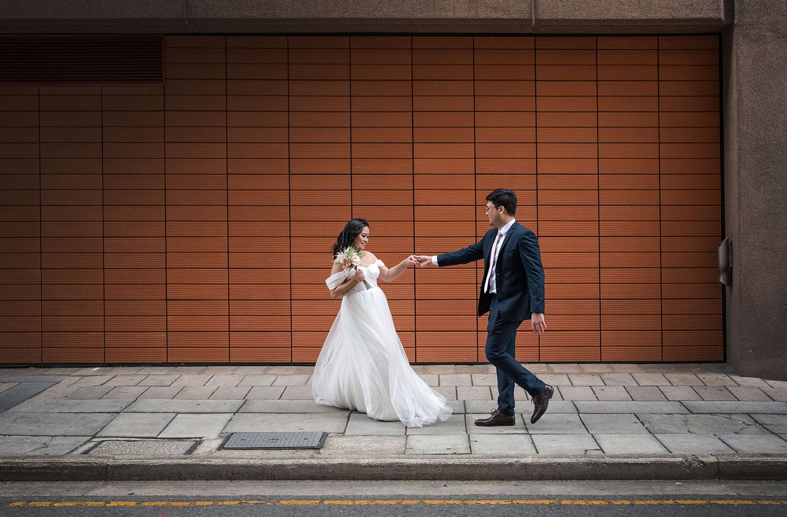 chesser st registration office wedding - khate & angelo 75 Bride leading groom on merry walk