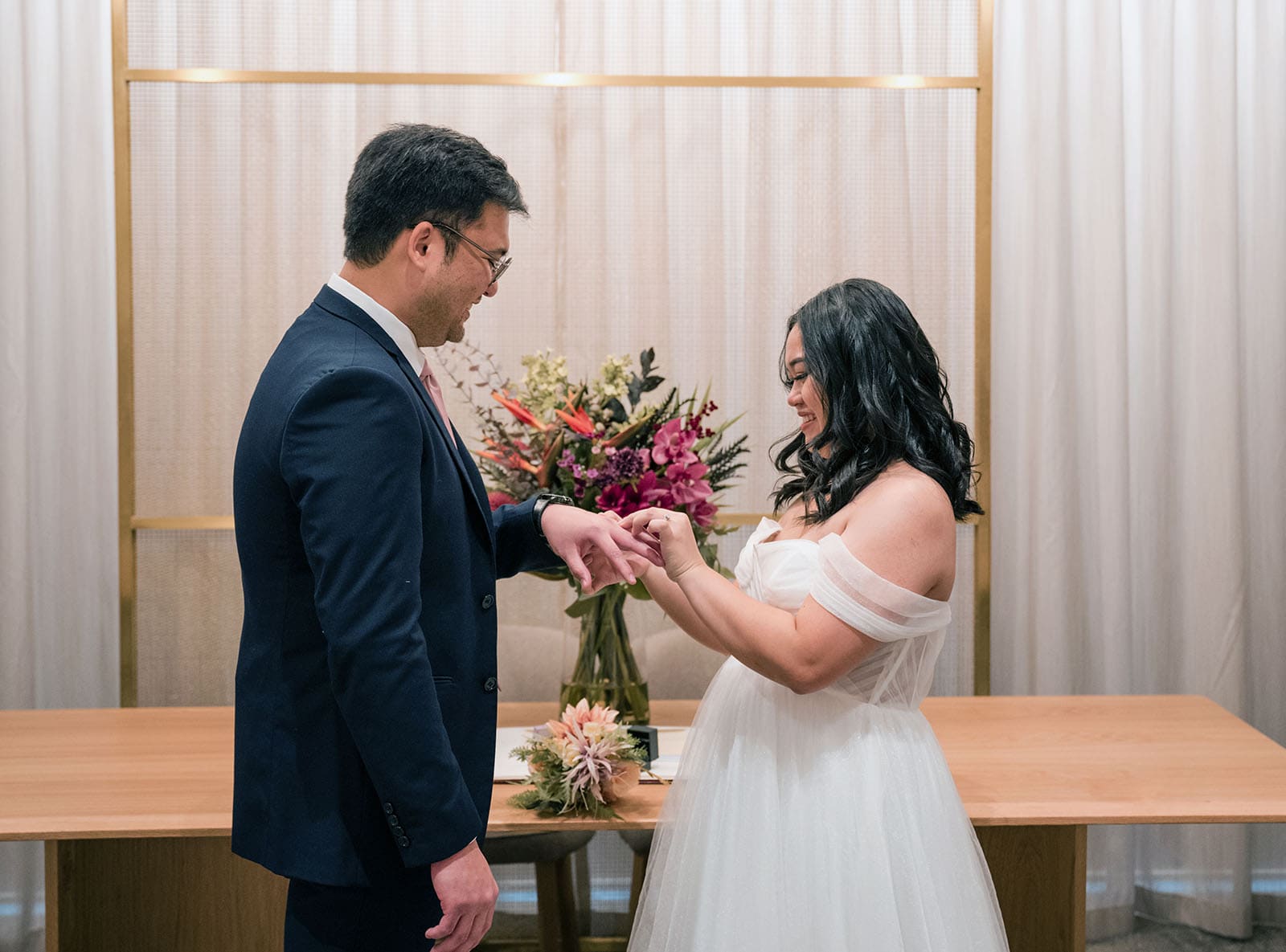 chesser st registration office wedding - khate & angelo 68 Bride placing ring on groom's finger
