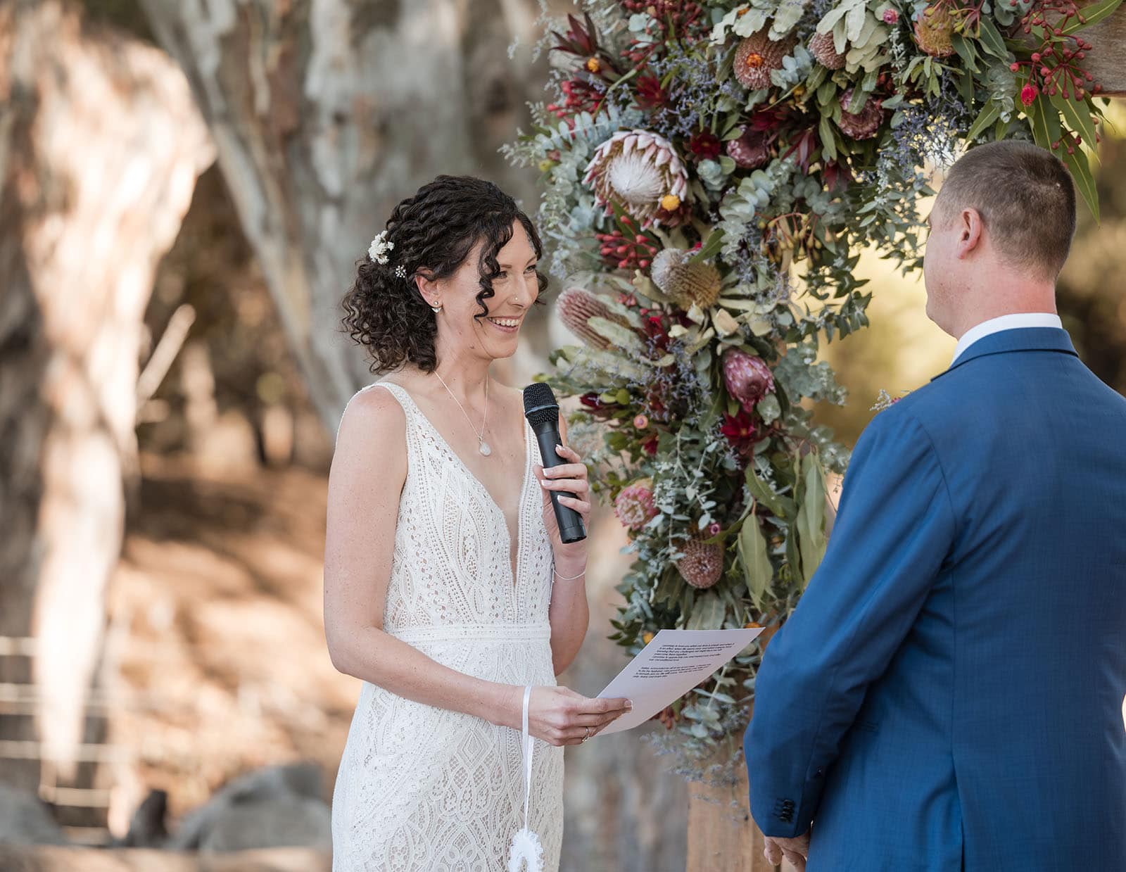 white hill estate wedding - catherine & sean 293 Bride smiling reading vows