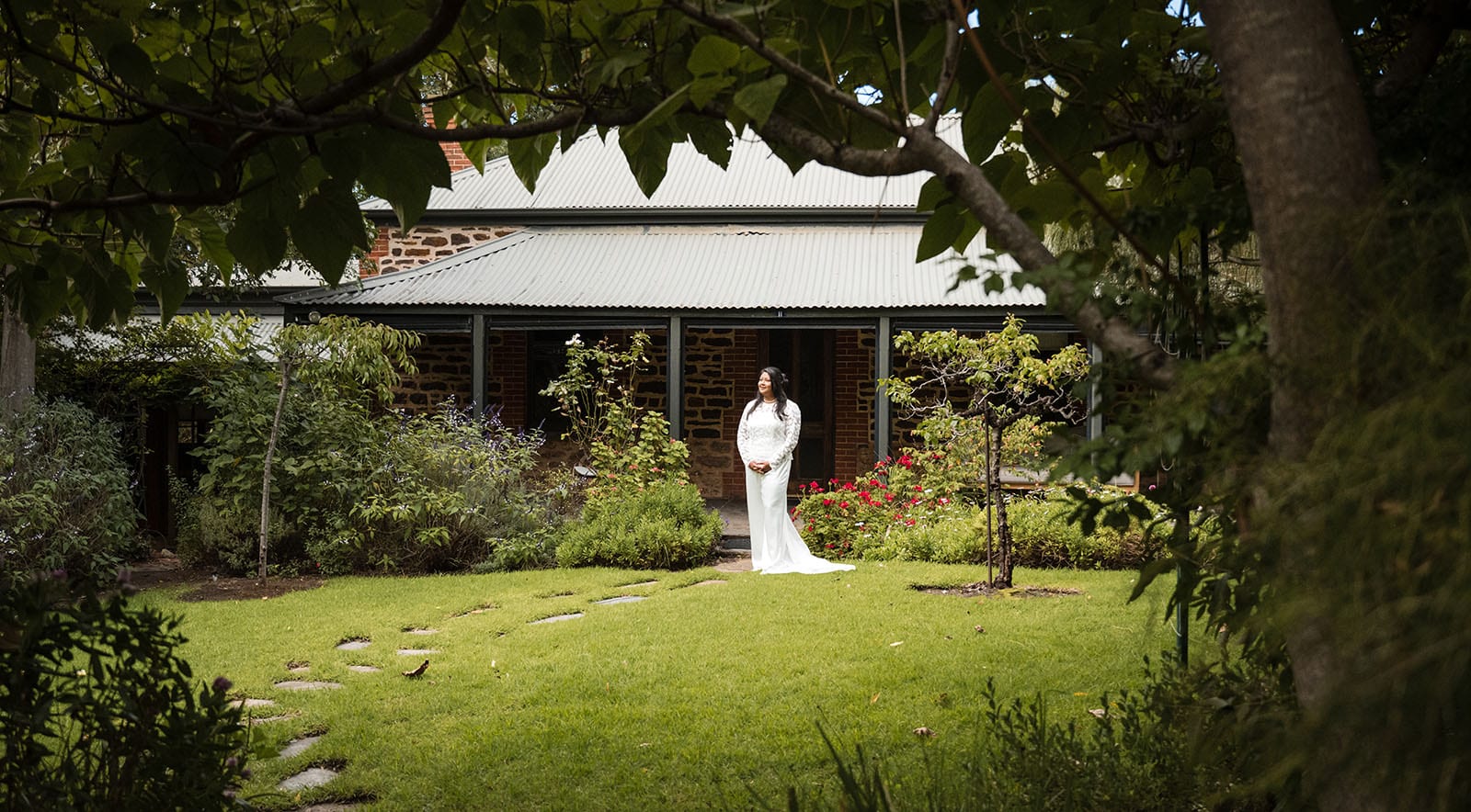 vine shed wedding - kat & katie 198 Bride standing in front of the Secret Garden