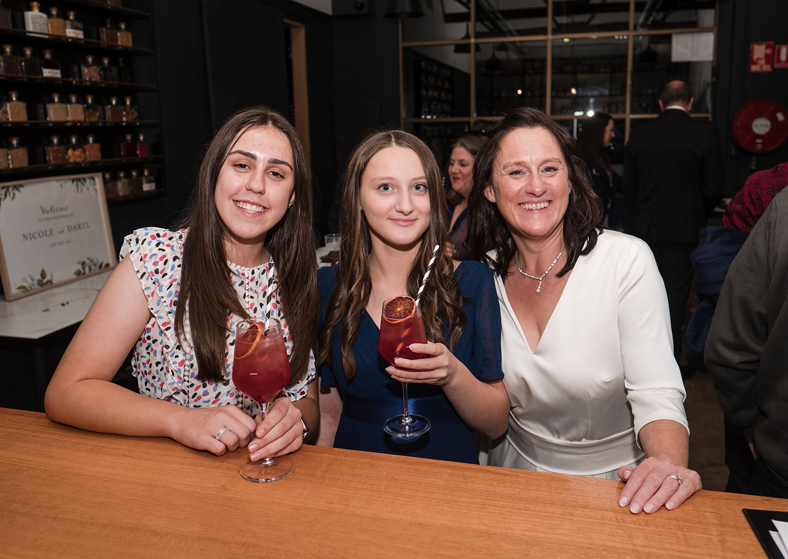 northern palm garden wedding - nicole & daryl 149 bride with two ladies and drink