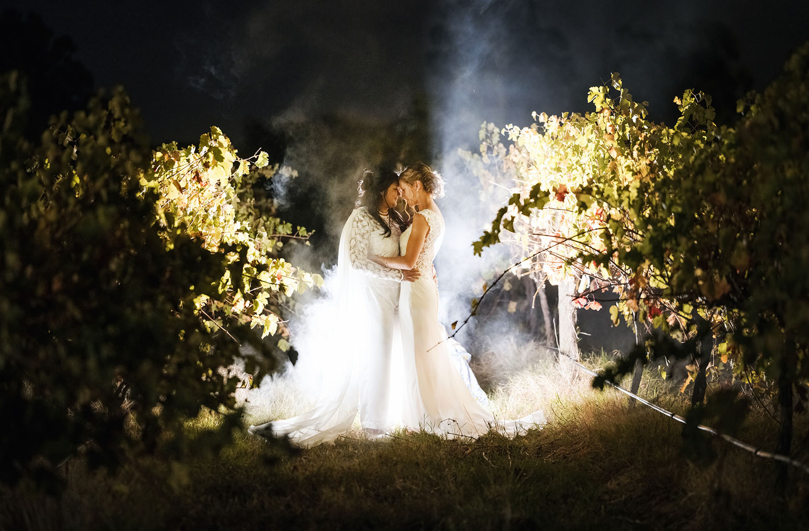vine shed wedding - kat & katie 246 brides at night with smoke in vines