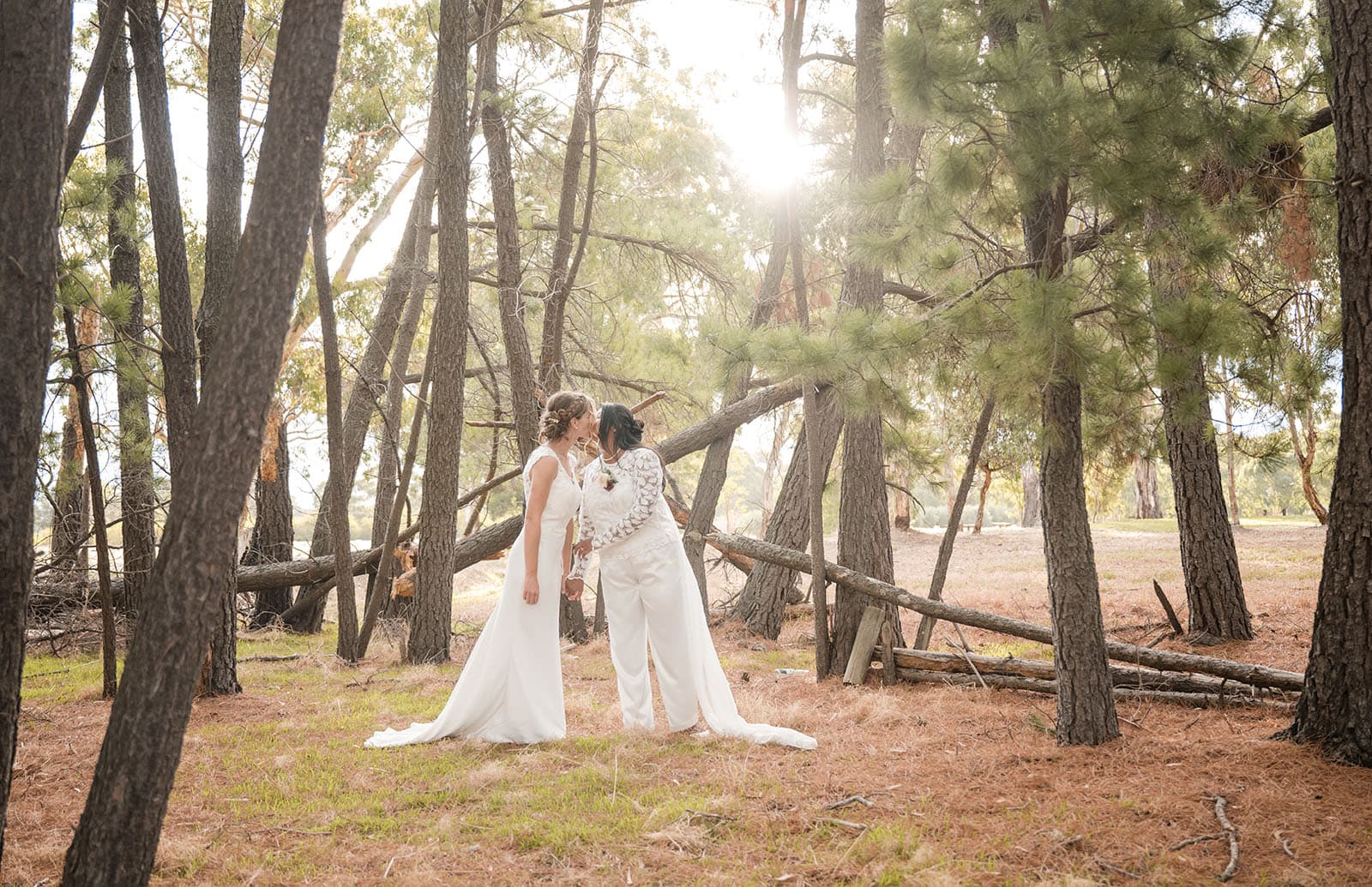 vine shed wedding - kat & katie 236 Brides kissing in pine trees