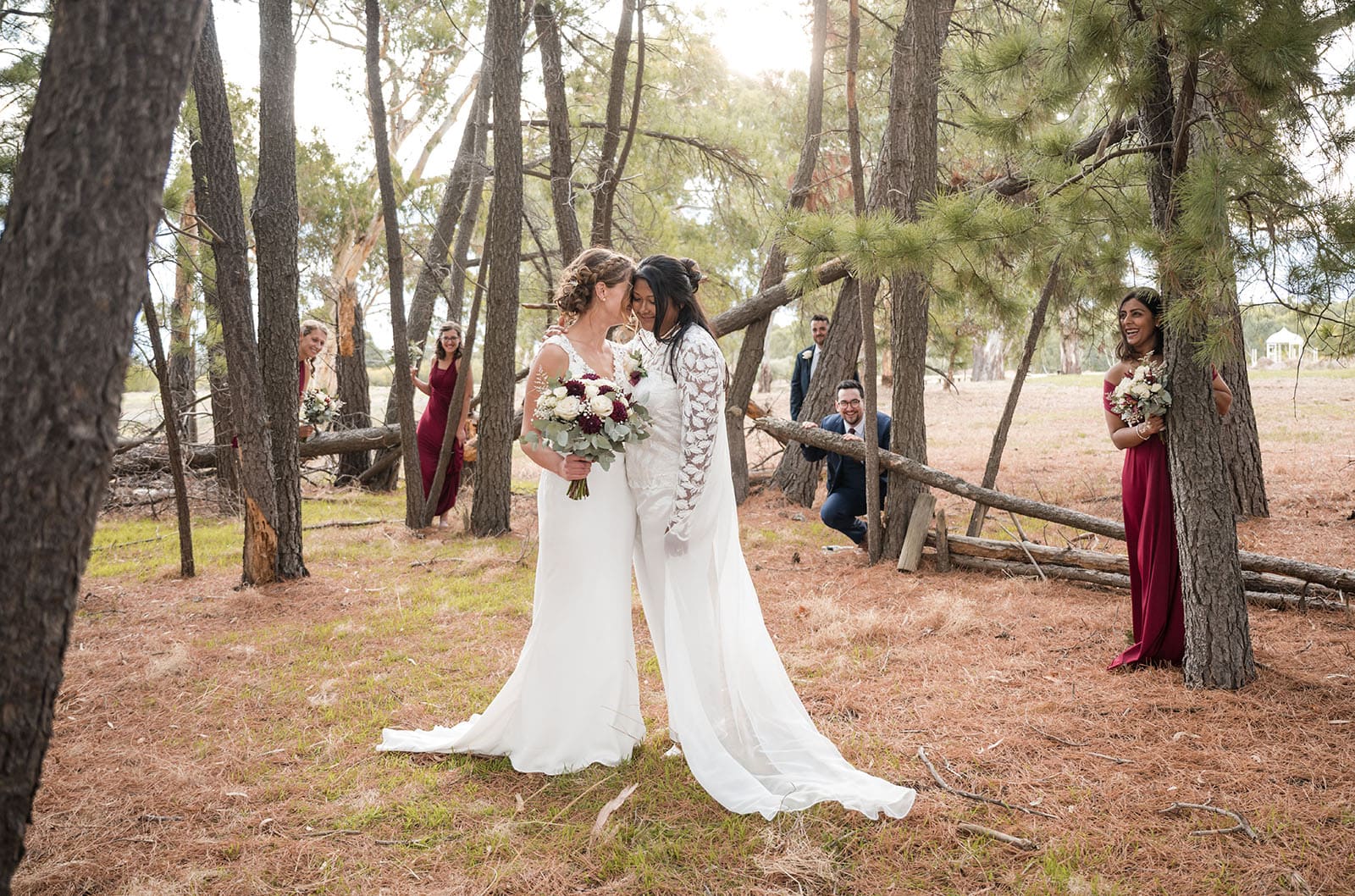 vine shed wedding - kat & katie 237 Brides with bridal party in pine trees