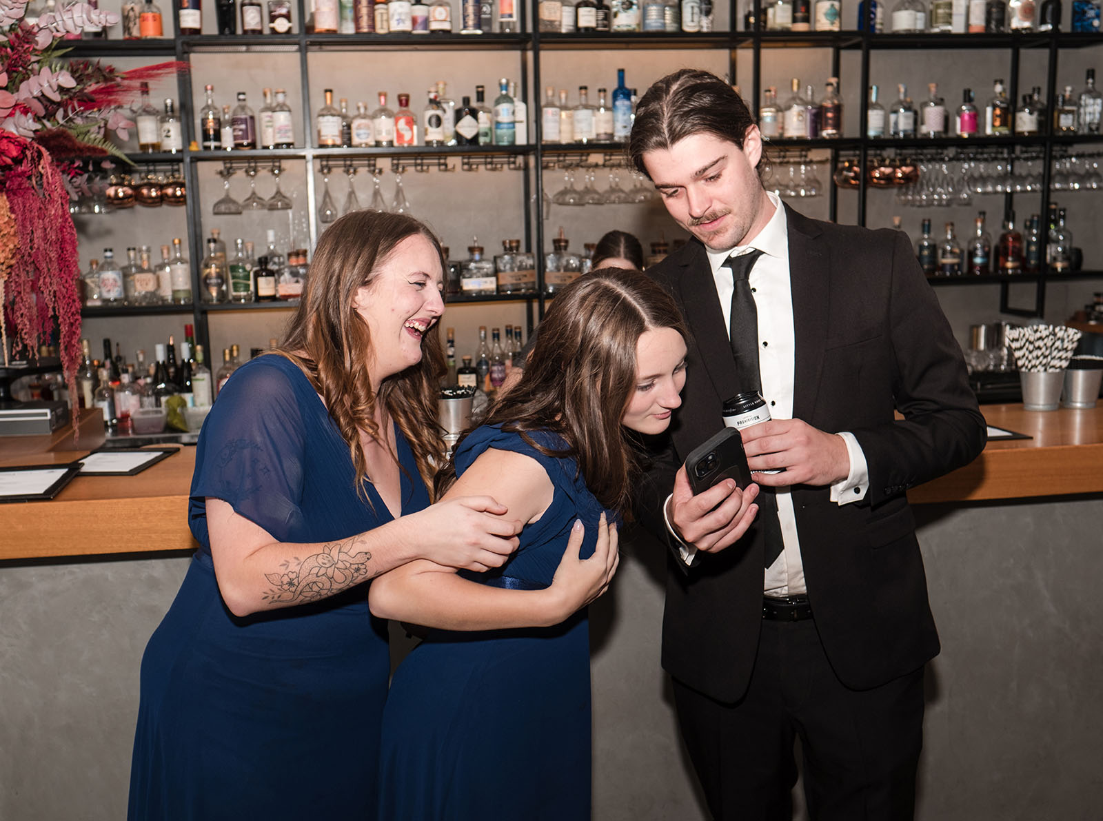 northern palm garden wedding - nicole & daryl 150 Bridesmaids checking phone