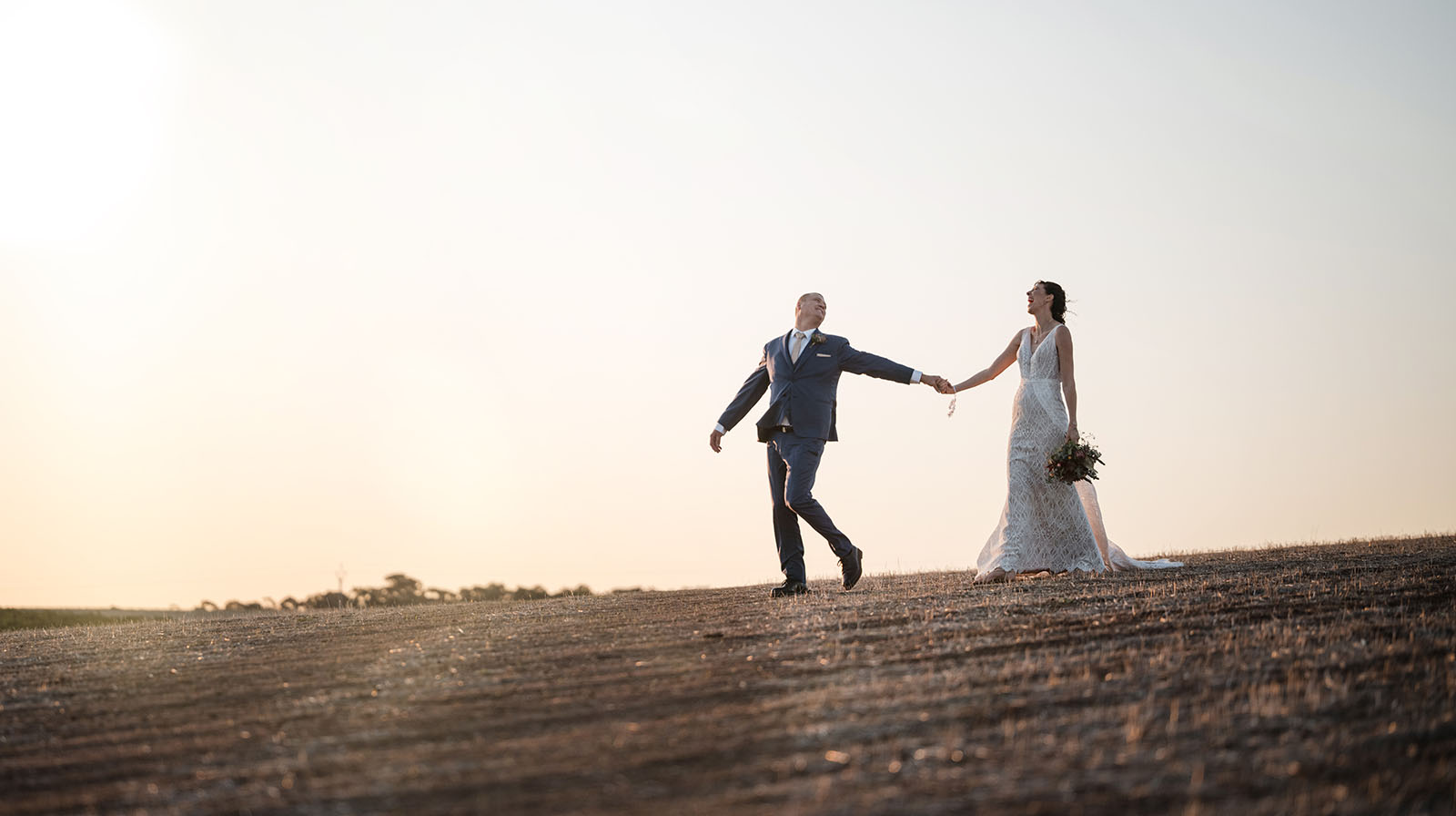 white hill estate wedding - catherine & sean 318 Dramatic leadning bride through field