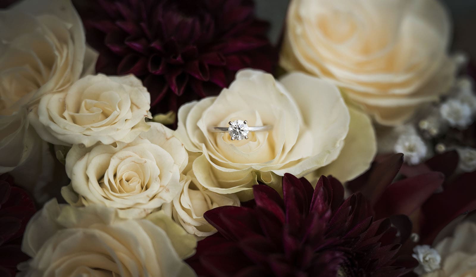 vine shed wedding - kat & katie 199 Engagement ring in white flower bouquet