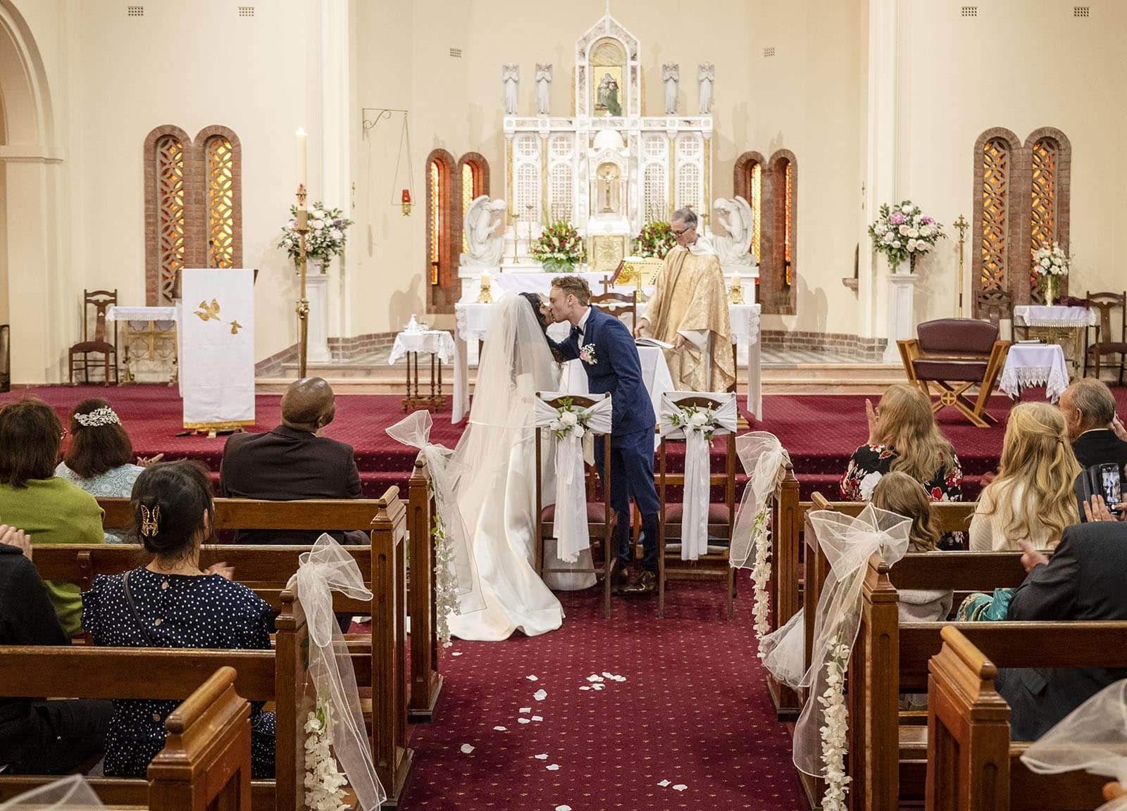 our lady of the rosary church wedding - lorraine & wayne 169 First kiss at Our Lady of the Rosary Church Wedding