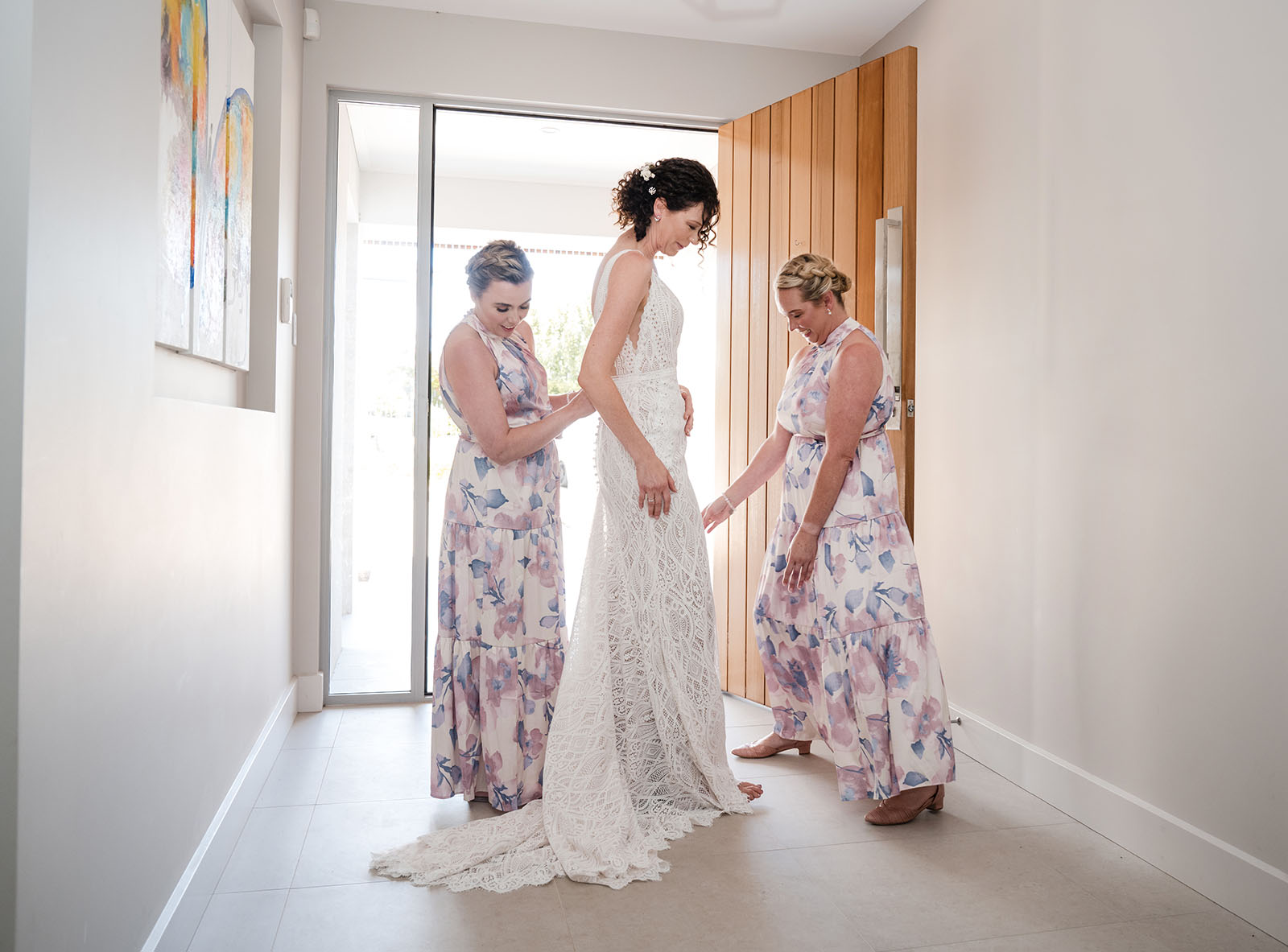 white hill estate wedding - catherine & sean 278 Floral bridesmaids helping with bridal gown