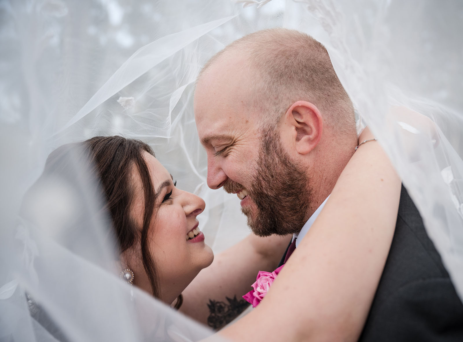 ten22 wedding - julia & daniel 172 Grinning couple under bridal veil