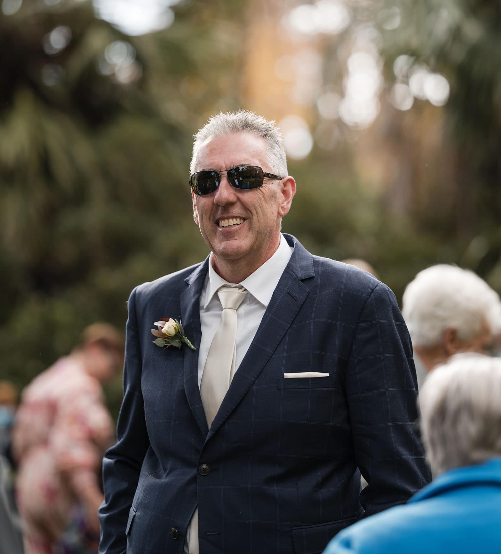 northern palm garden wedding - nicole & daryl 108 Grinning groom waiting for ceremony