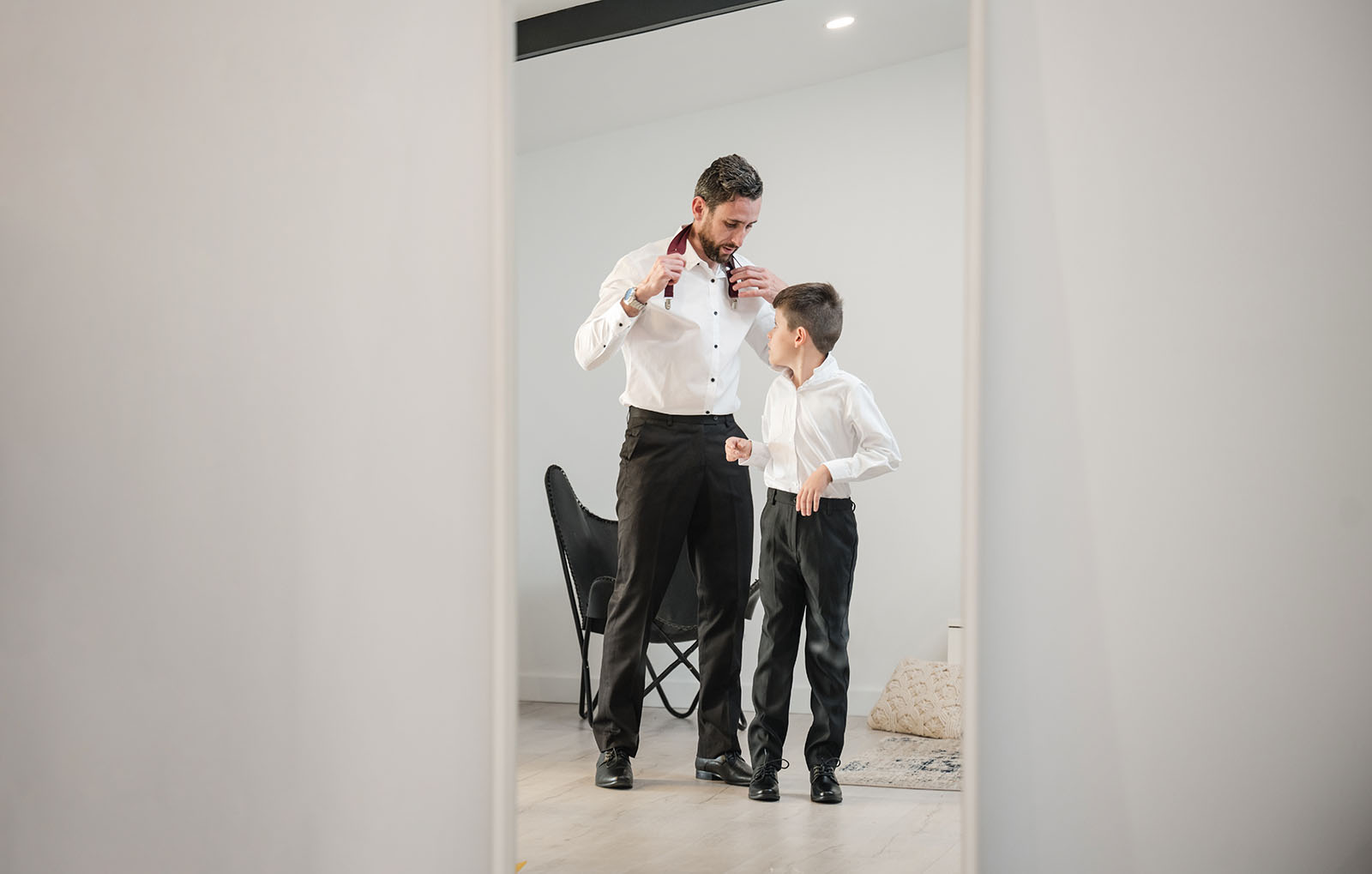 sneakys wedding - ash & michael 48 Groom and son in mirror