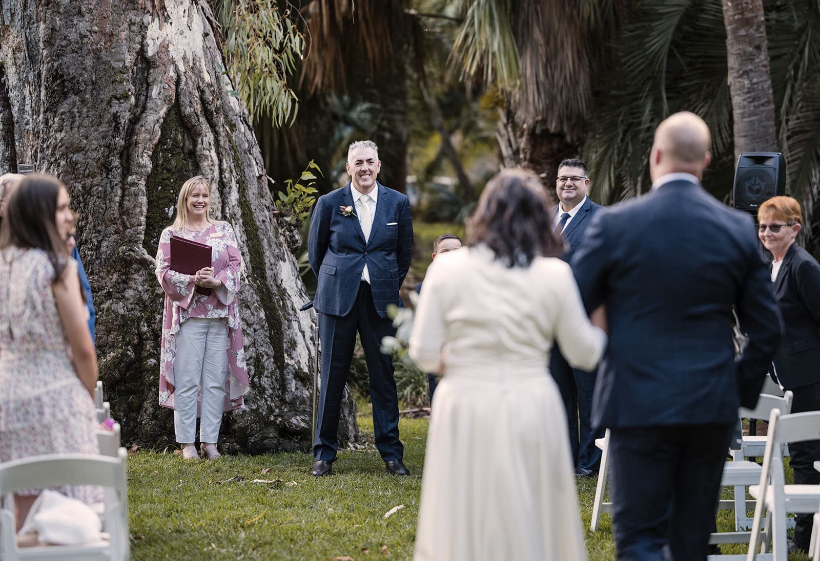 northern palm garden wedding - nicole & daryl 113 Groom watching as his bride approaches