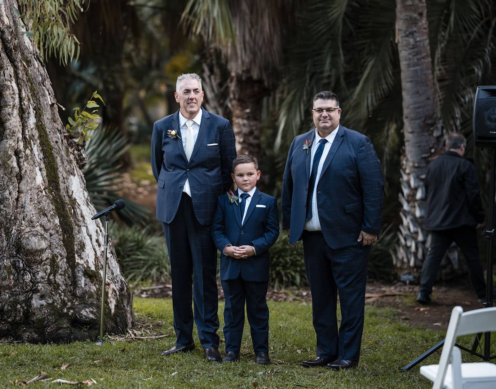 northern palm garden wedding - nicole & daryl 110 Groom with his zon and entourage