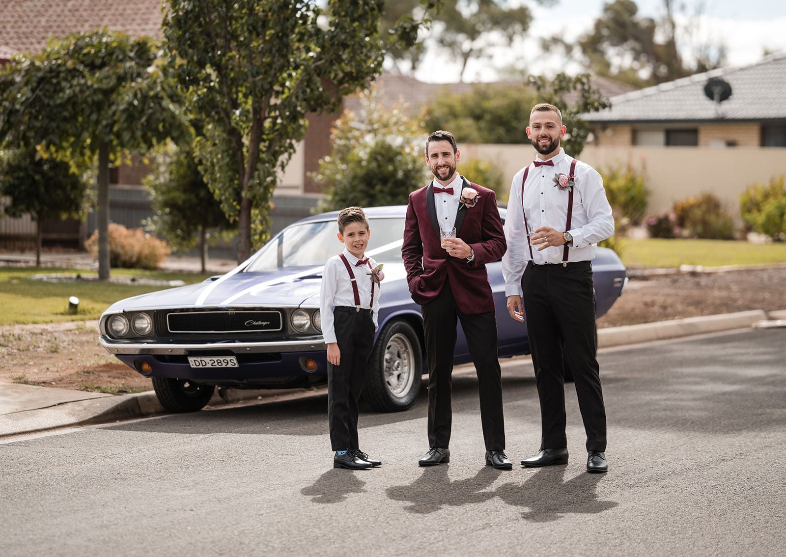 sneakys wedding - ash & michael 53 Groomsmen in front of purple muscle car