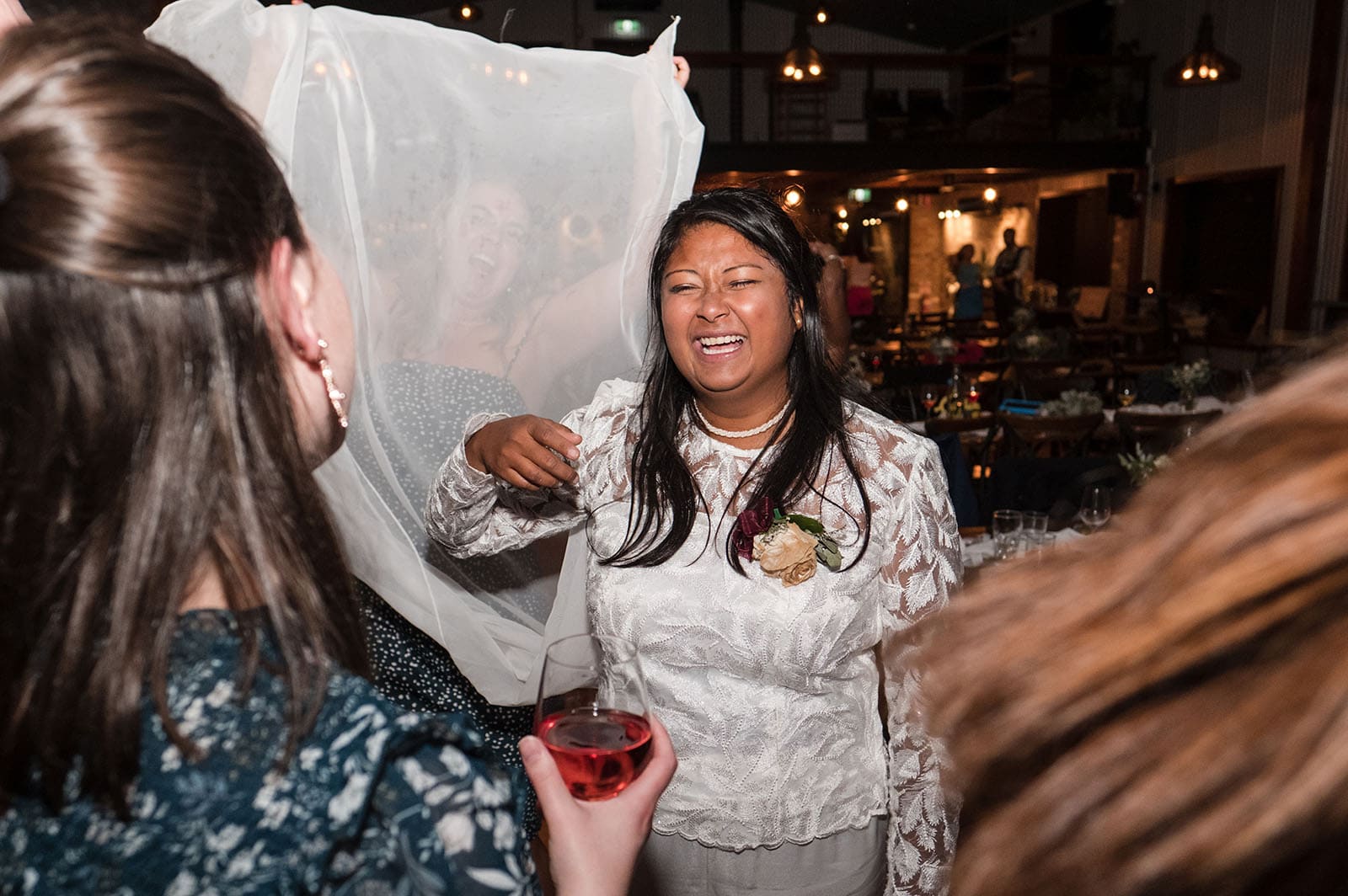 vine shed wedding - kat & katie 259 Guest having fun with bridal outfit