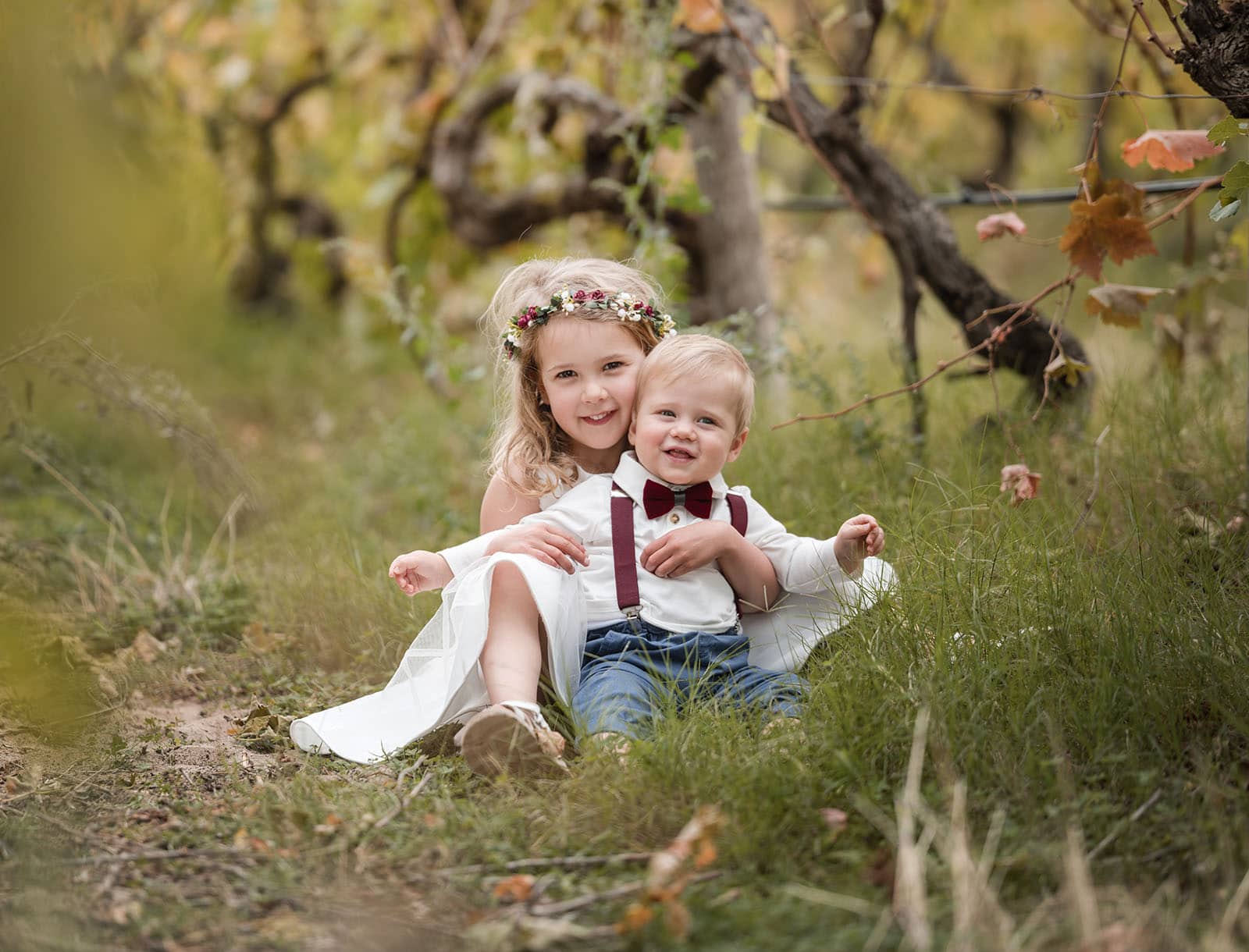vine shed wedding - kat & katie 214 Kids sitting together in vineyard