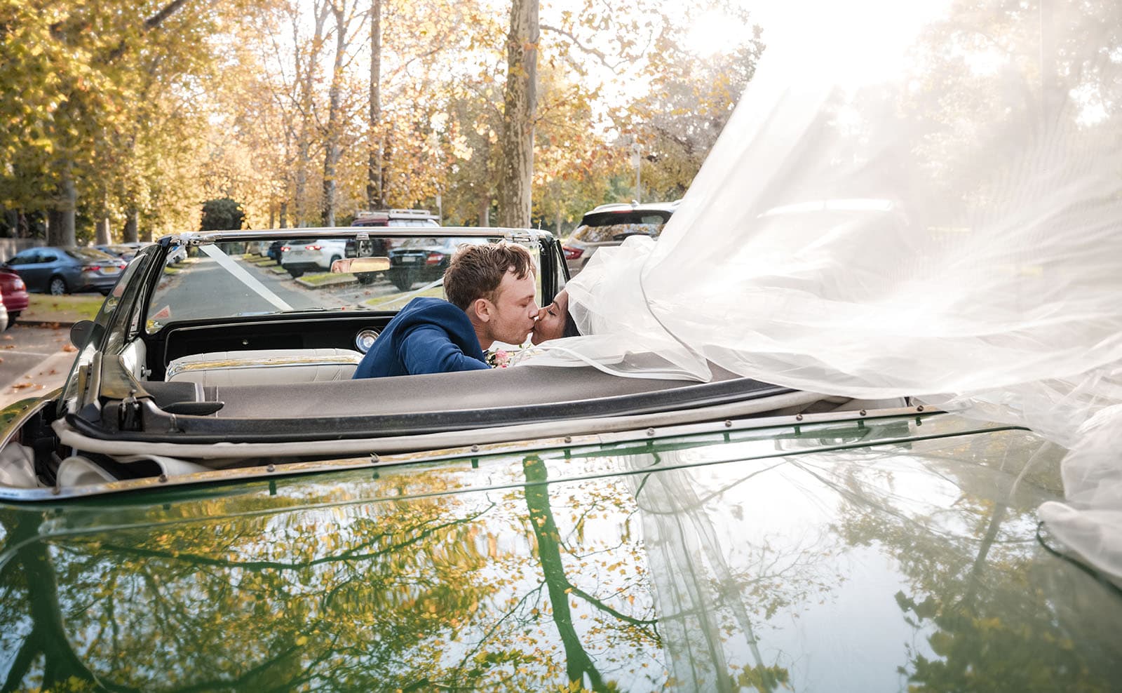 our lady of the rosary church wedding - lorraine & wayne 173 Kiss in back of muscle car