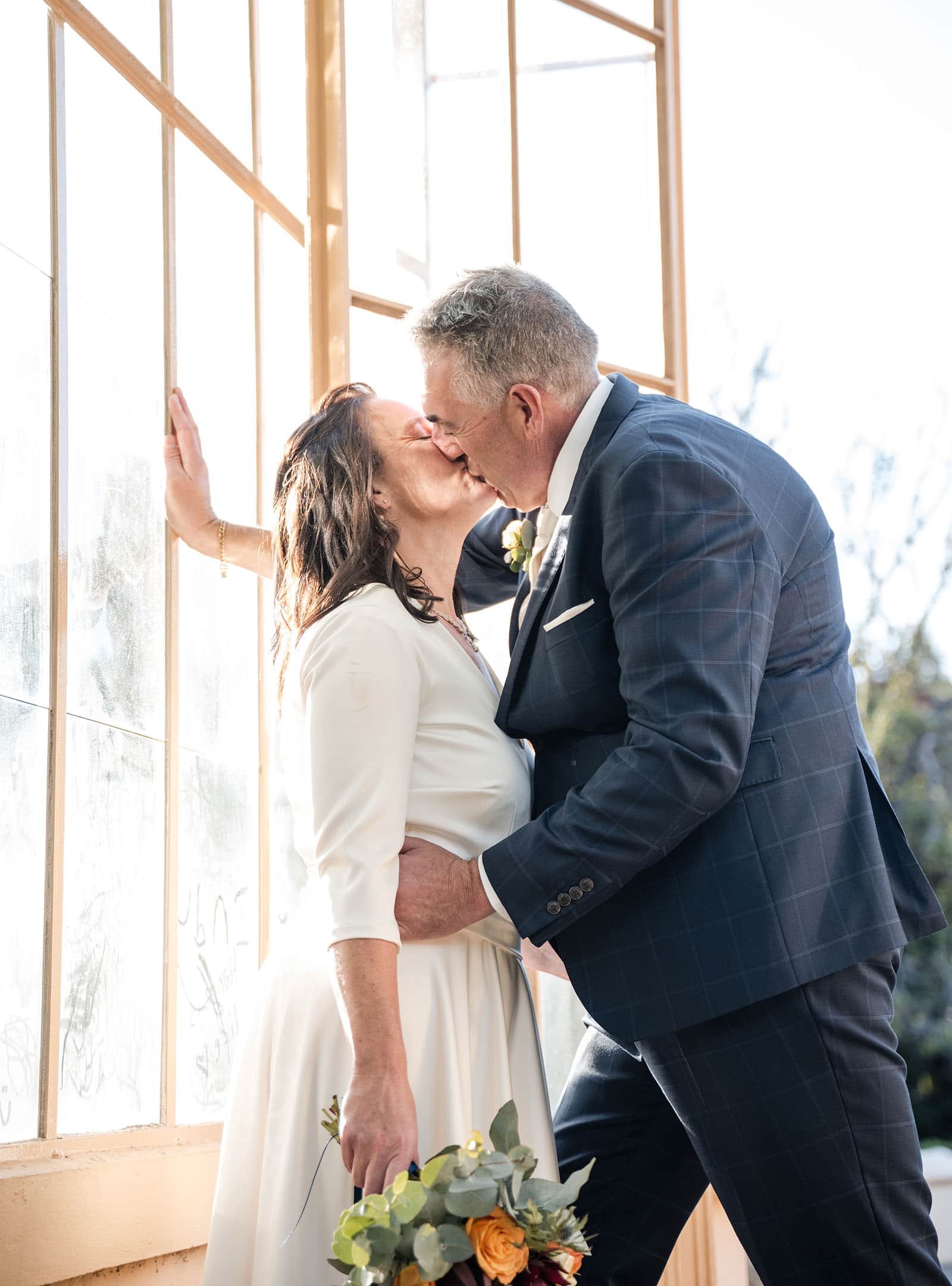 northern palm garden wedding - nicole & daryl 135 Kiss in the Adelaide Botanic Gardens greenhouse