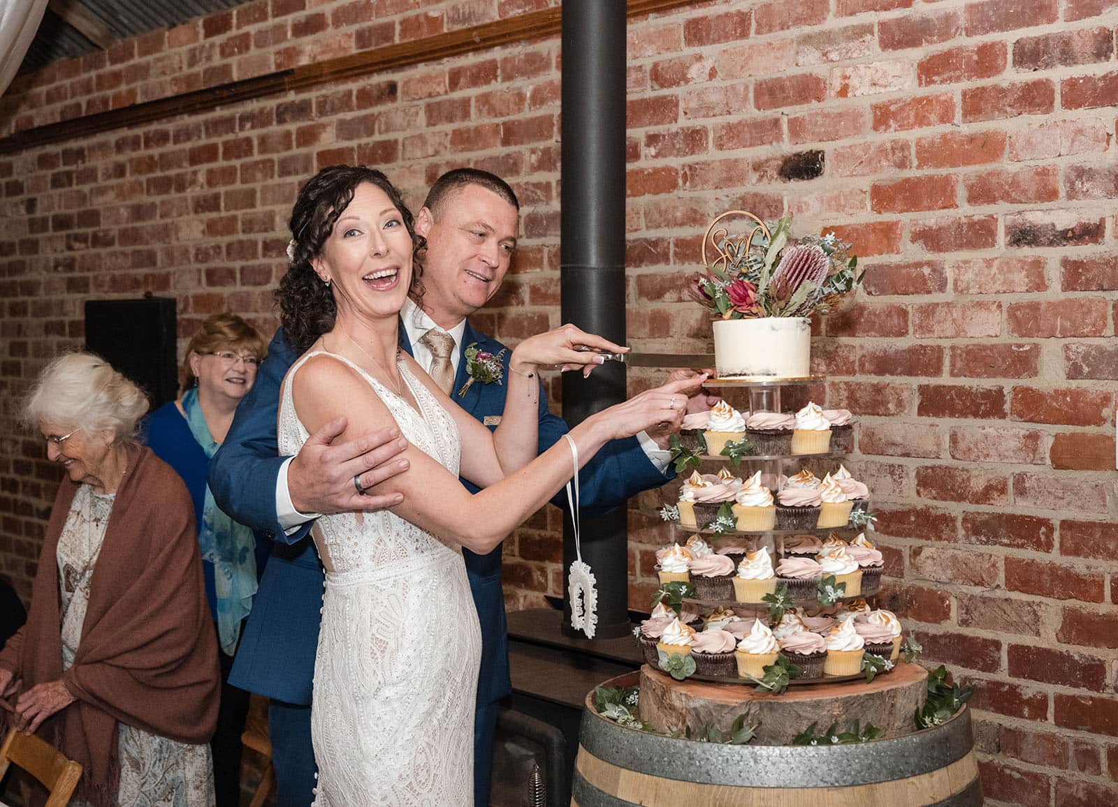 white hill estate wedding - catherine & sean 324 Laughing bride as cutting the cake