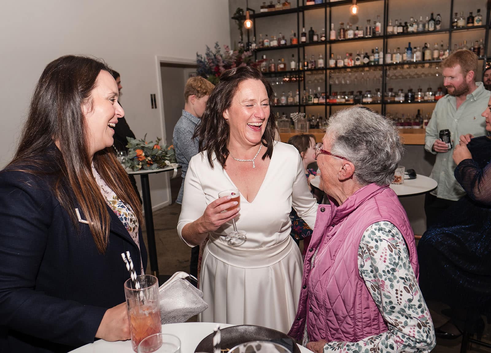 northern palm garden wedding - nicole & daryl 147 Laughing bride with guests