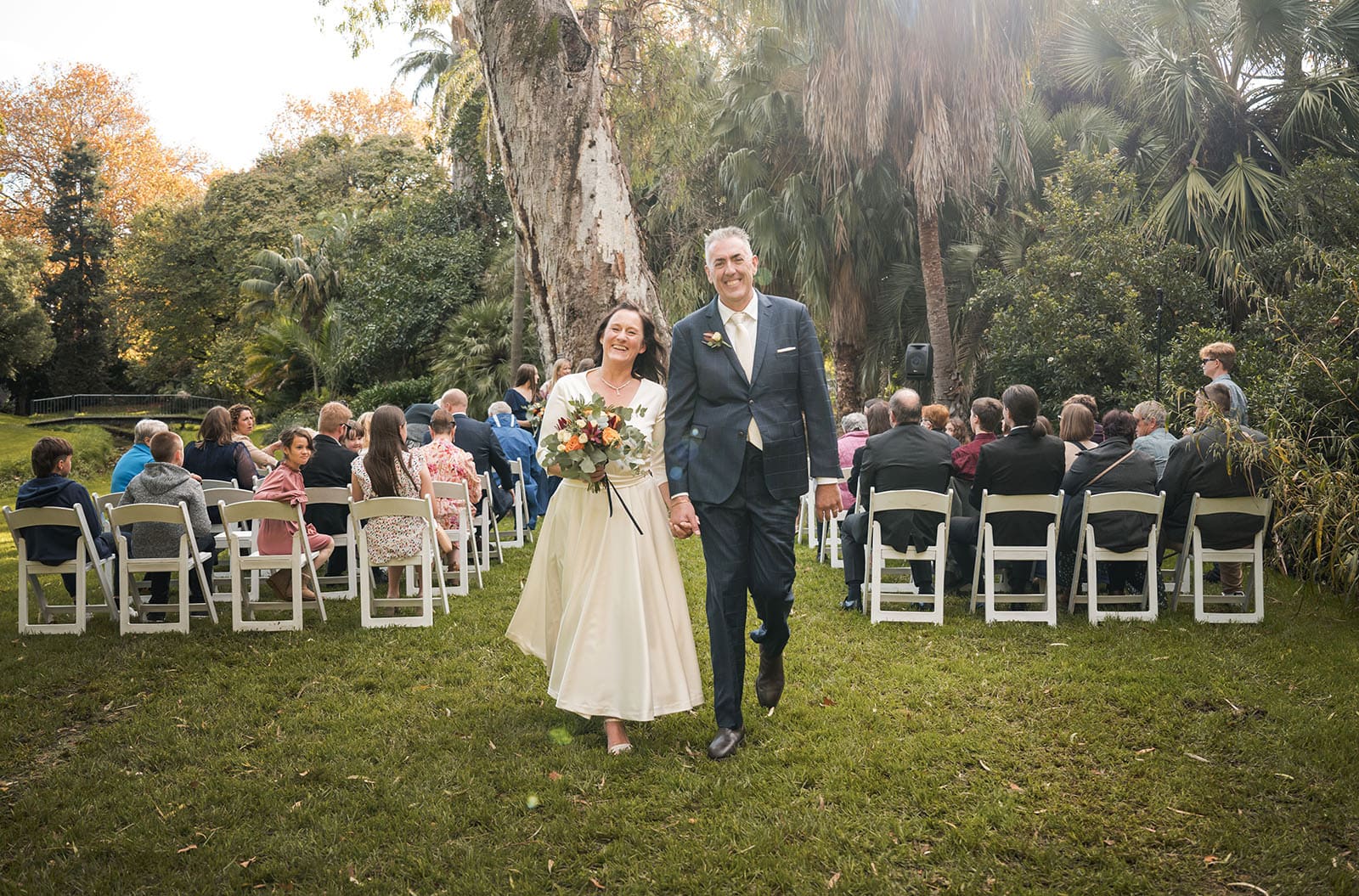 northern palm garden wedding - nicole & daryl 122 Married couple exiting cermeony