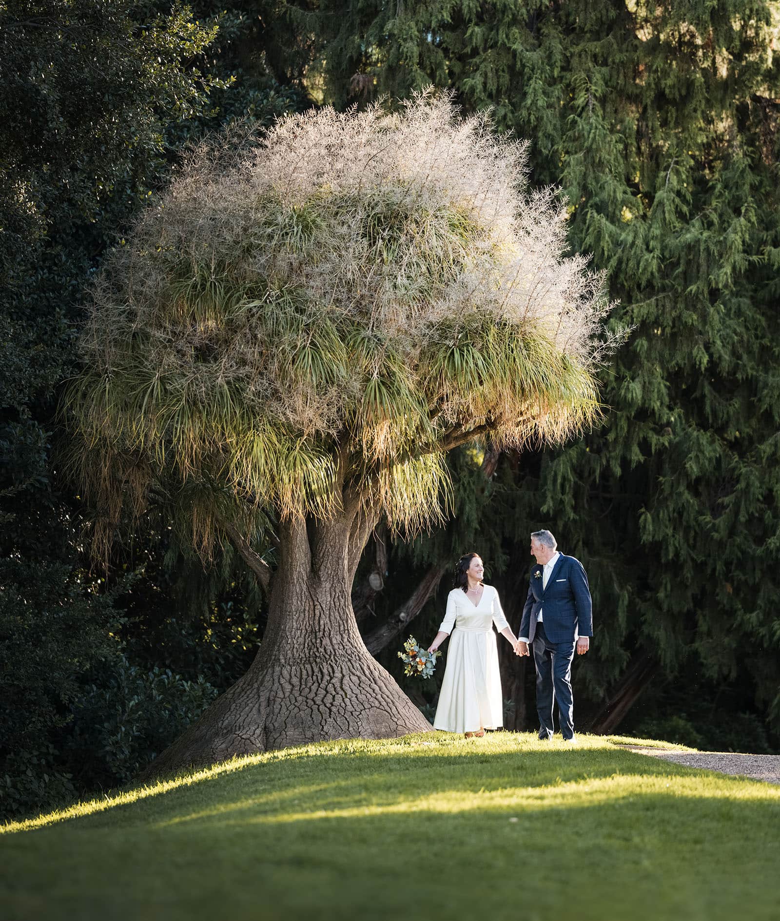 northern palm garden wedding - nicole & daryl 136 Married couple under Dr Suess Tree