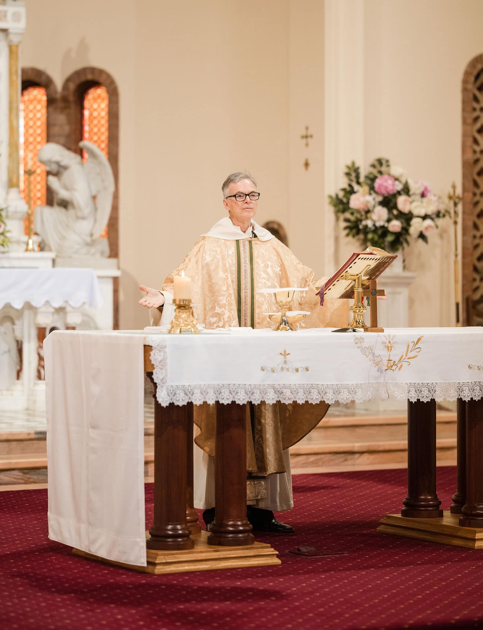 our lady of the rosary church wedding - lorraine & wayne 165 Priest beginning mass