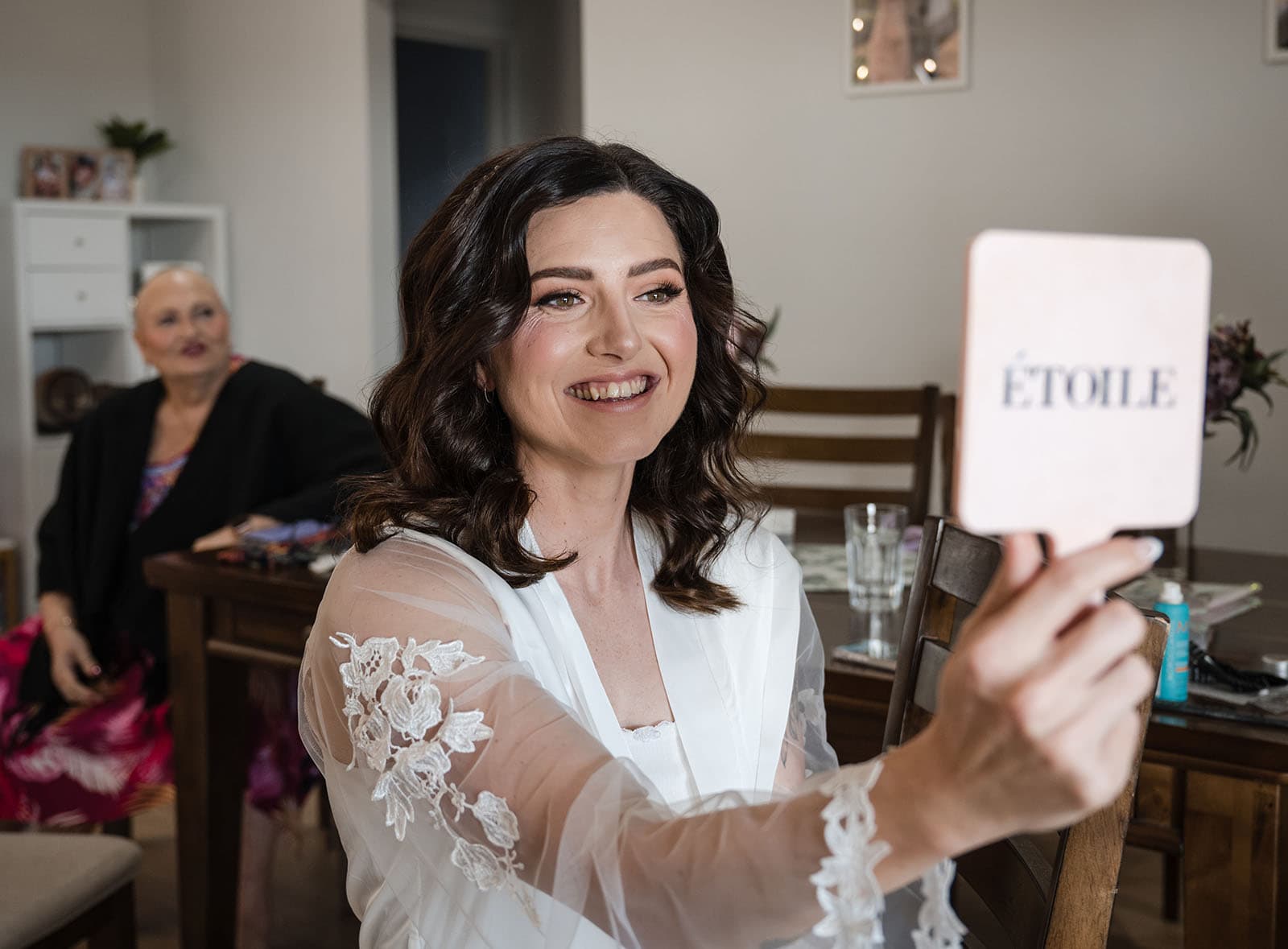 sneakys wedding - ash & michael 59 Smiling bride looking into hand mirror