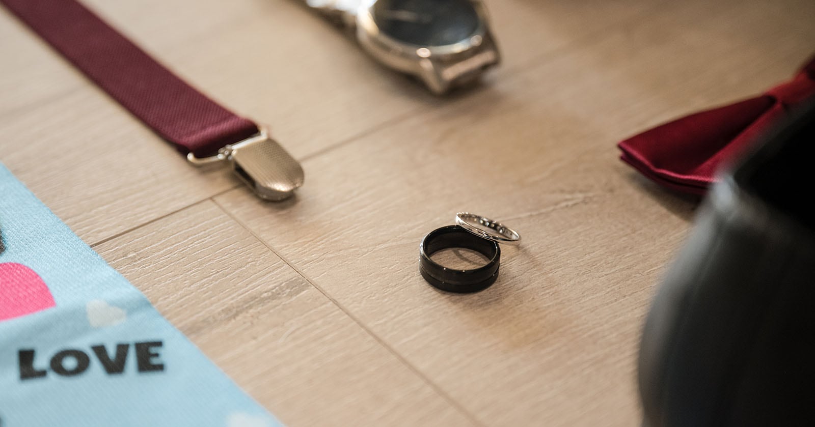 sneakys wedding - ash & michael 43 Wedding rings on floor with affects