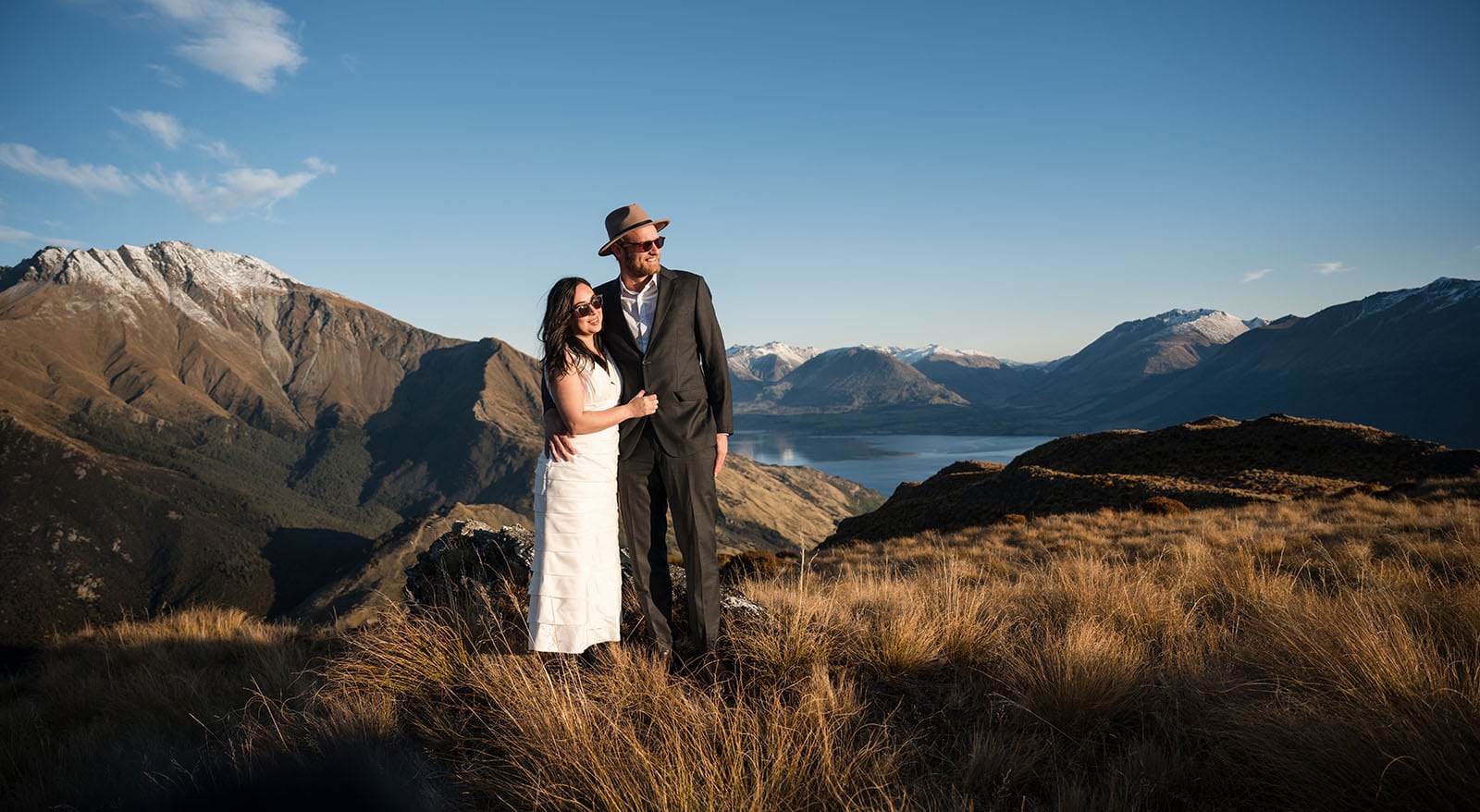 incredible queenstown wedding photoshoot - wendy & frank 42 Bride and groom surveying their domain