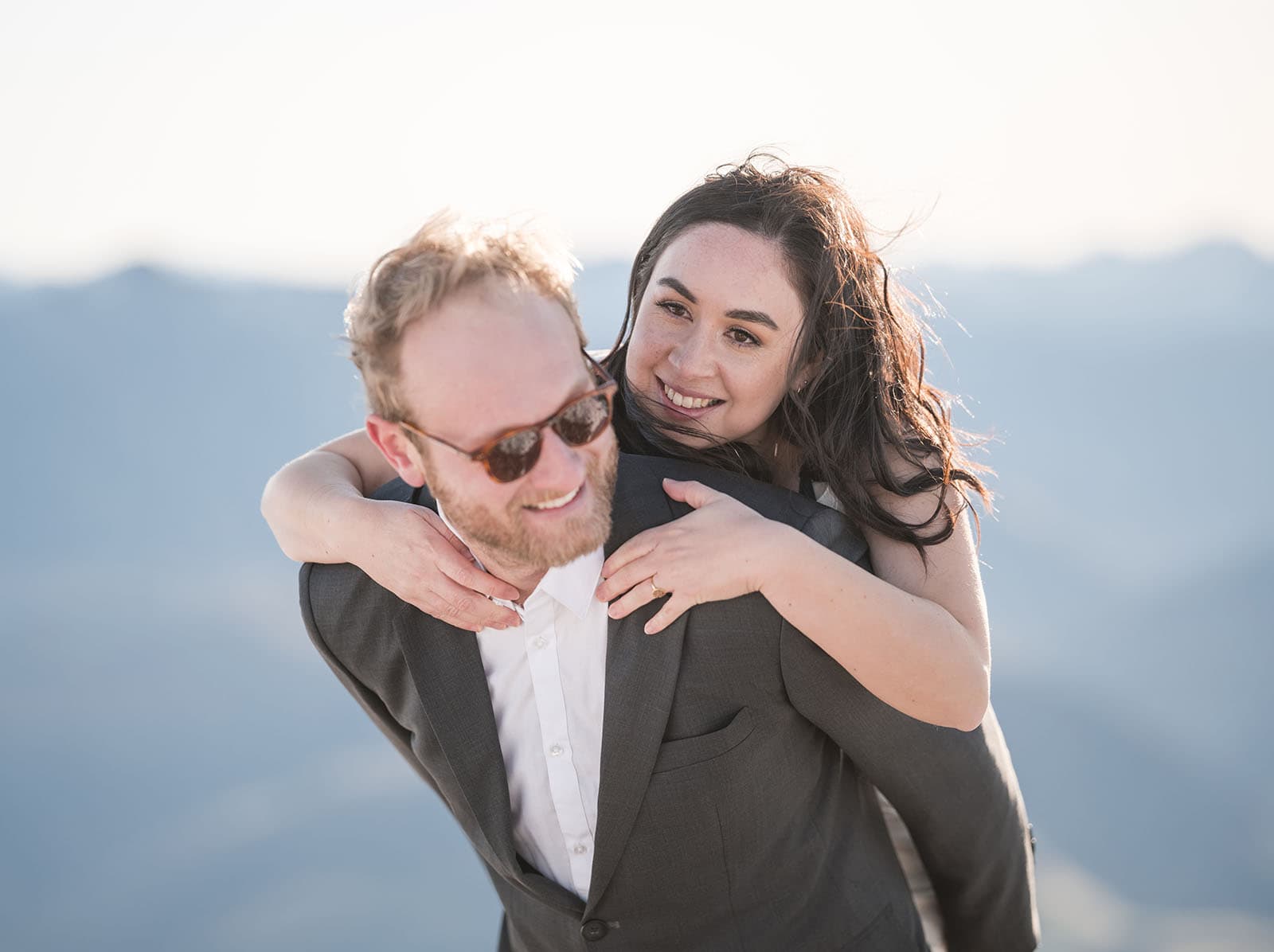 incredible queenstown wedding photoshoot - wendy & frank 37 bride getting a piggy back ride
