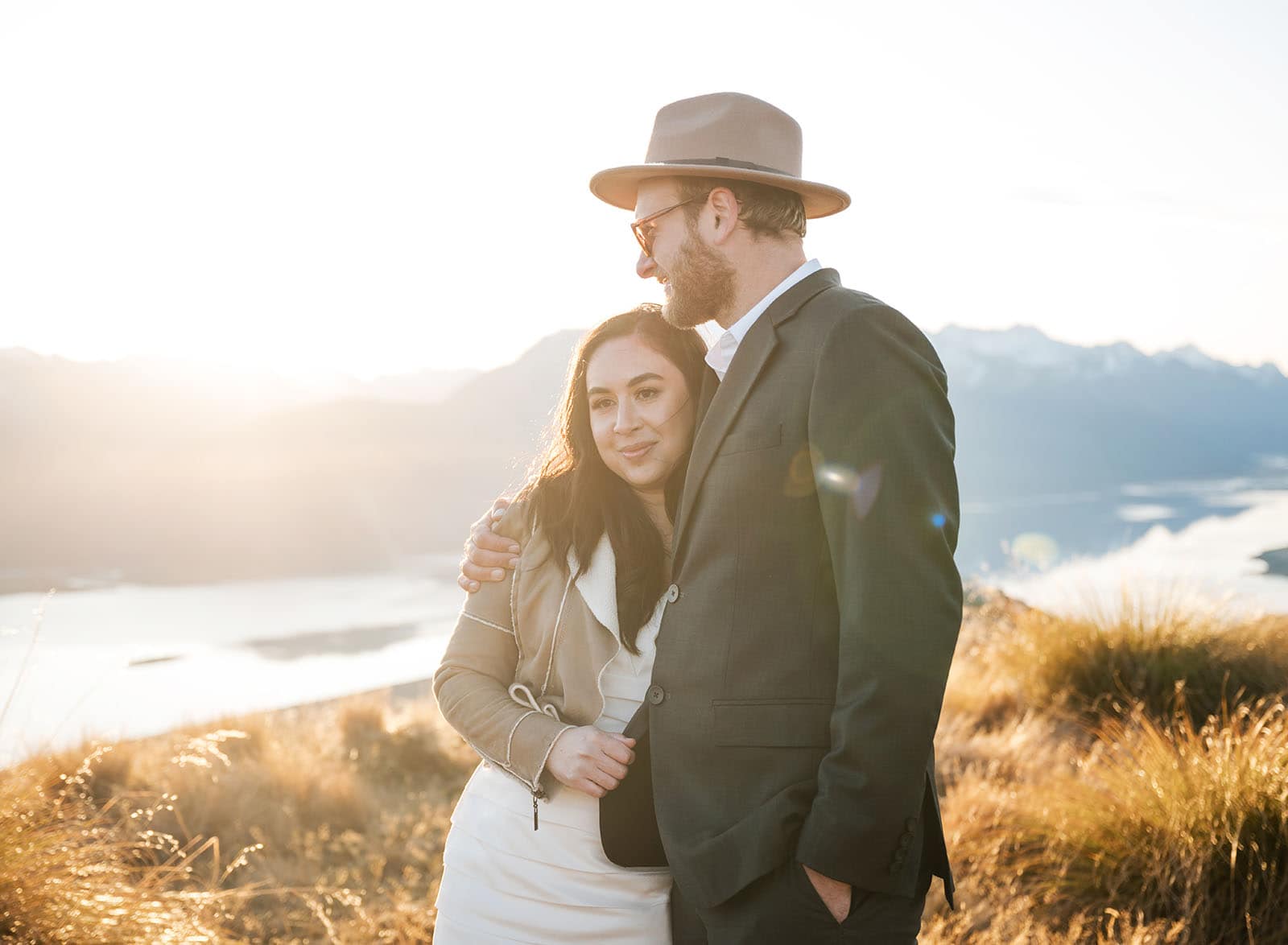 incredible queenstown wedding photoshoot - wendy & frank 55 Bright sunlight illuminating bride and groom