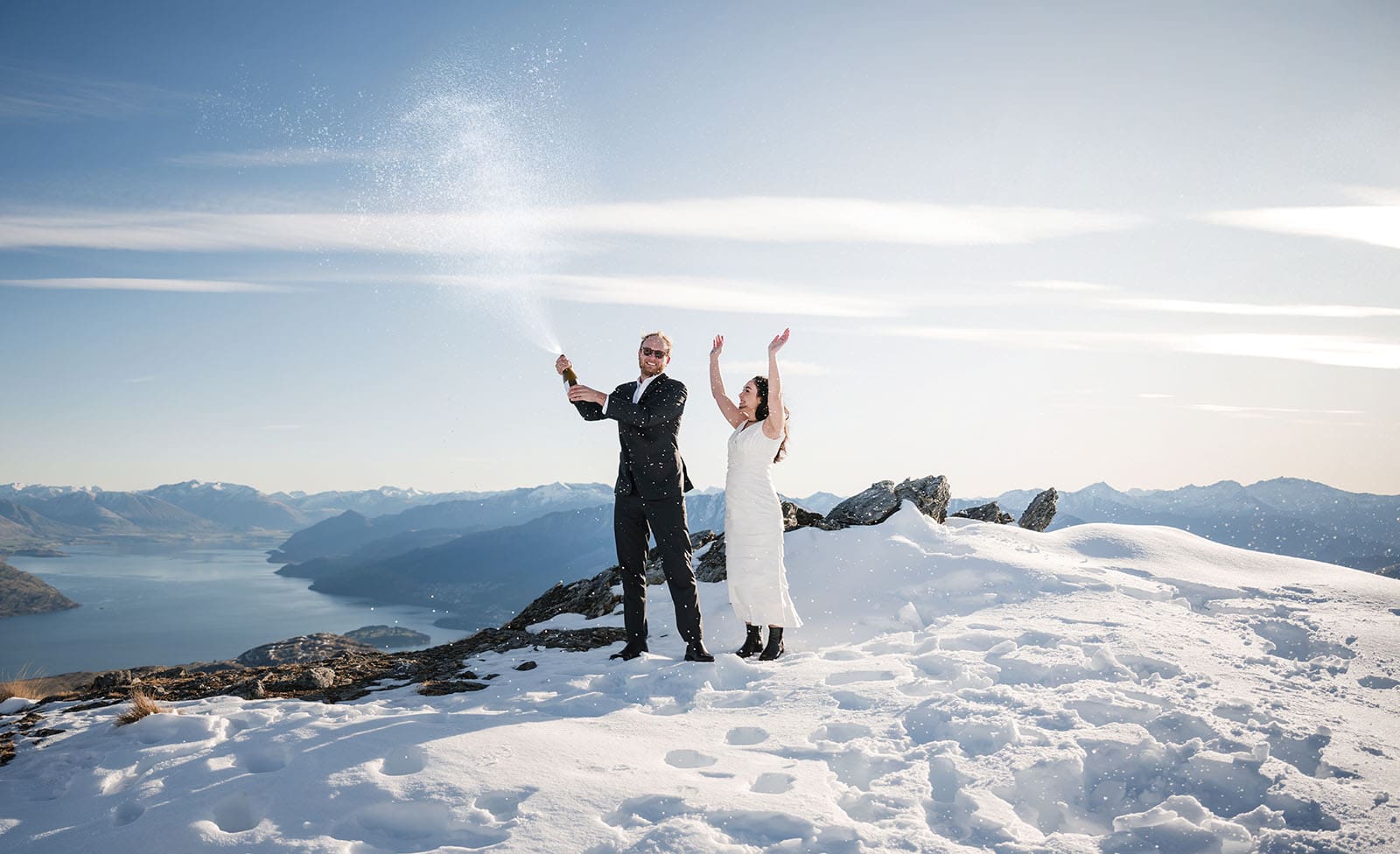 incredible queenstown wedding photoshoot - wendy & frank 29 Champagne photo on top of the Remarkables