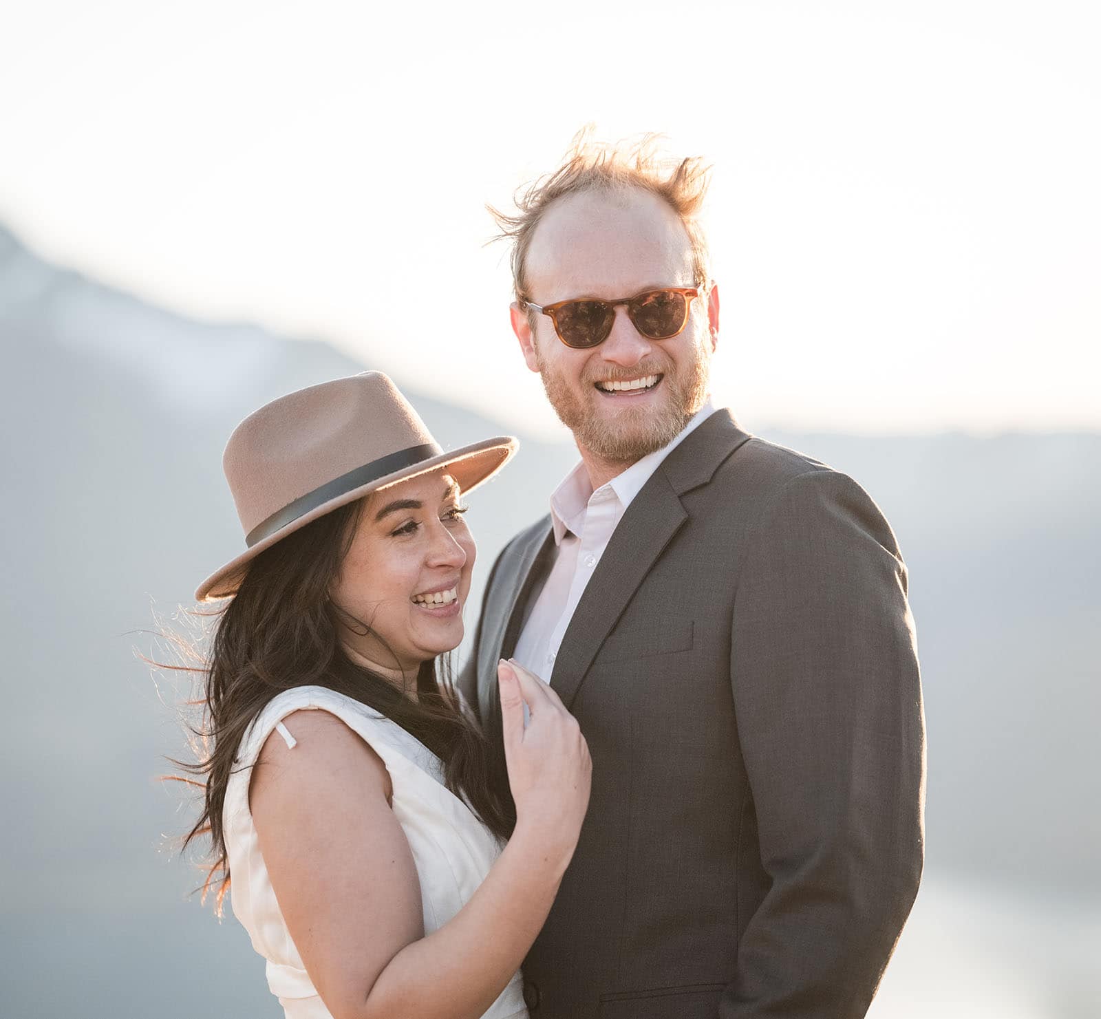 incredible queenstown wedding photoshoot - wendy & frank 59 Laughing bride and groom on Crighton Peak