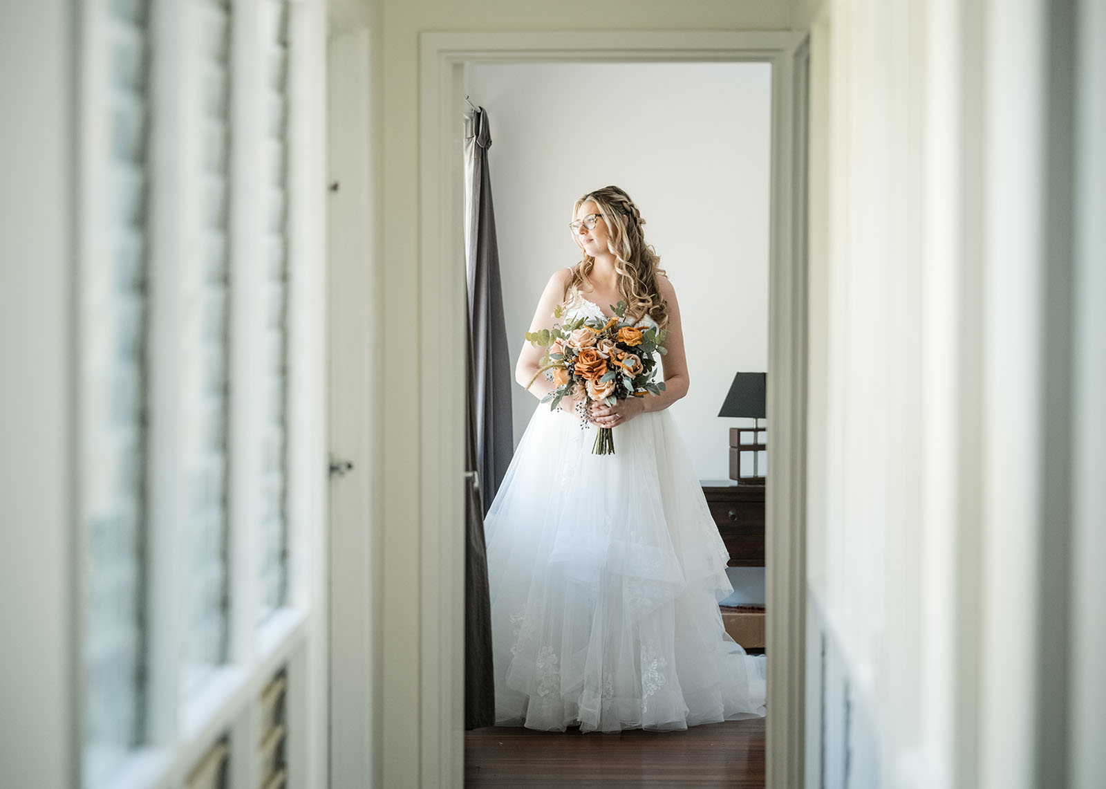 bridal eyewear: style tips for the ultimate wedding accessory 1 Bride at the end of hallway