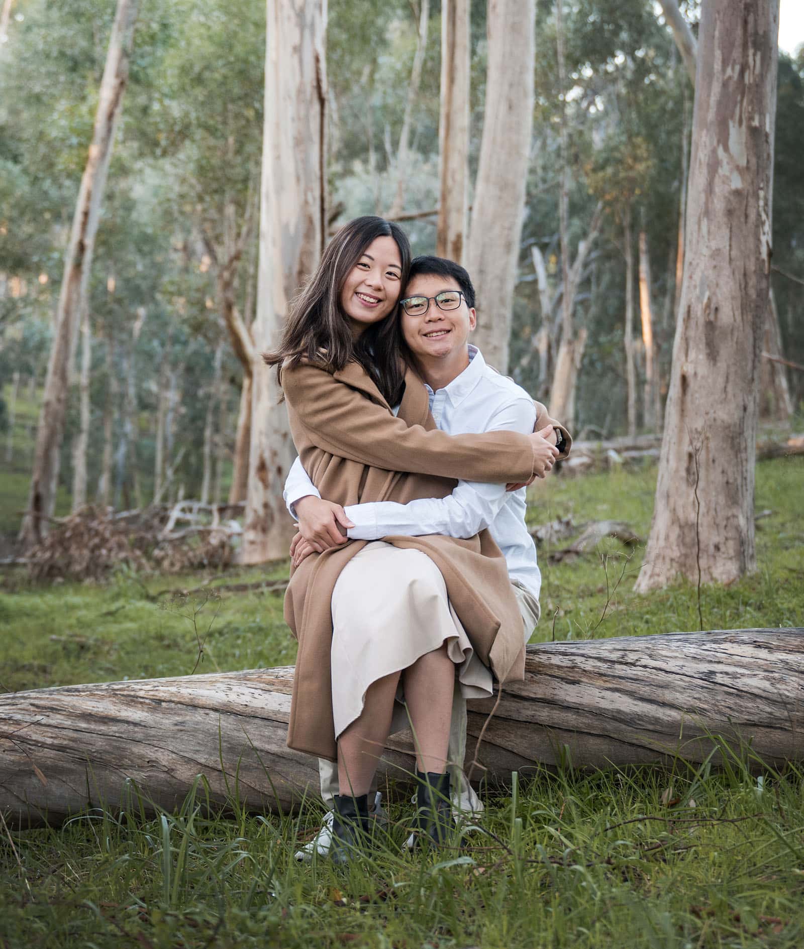belair train station engagement shoot - melody & chris 93 Couple hugs on a log