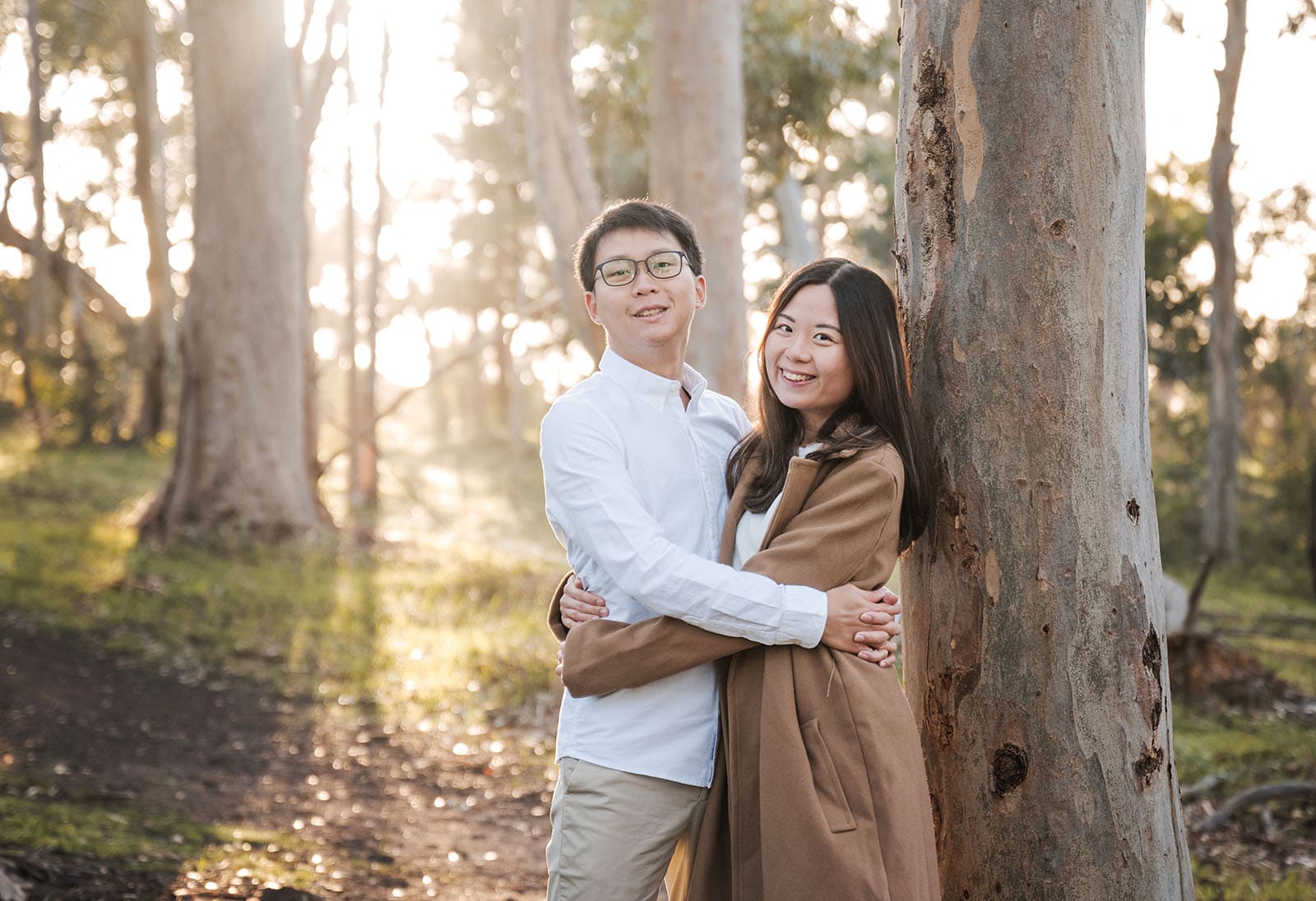 belair train station engagement shoot - melody & chris 107 Hugging next to gum tree