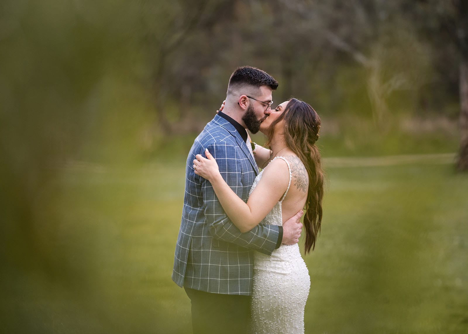 the house on haines wedding - emily & andrew 221 Bridal kiss through foliage