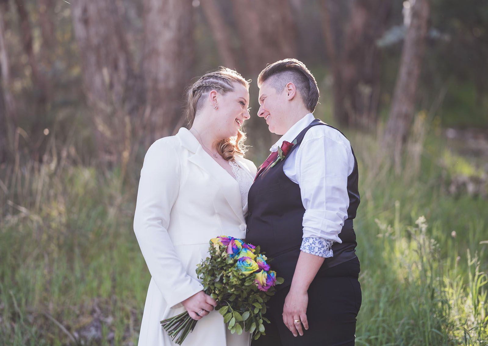tiny house on the prairie wedding - kat & stacey 95 Bridal couple bathed in sunlight