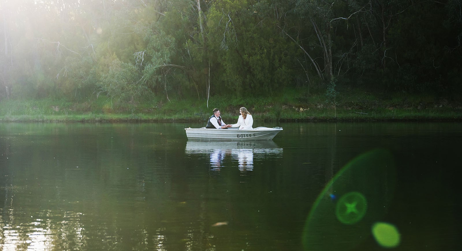 tiny house on the prairie wedding - kat & stacey 105 bridal couple on boat