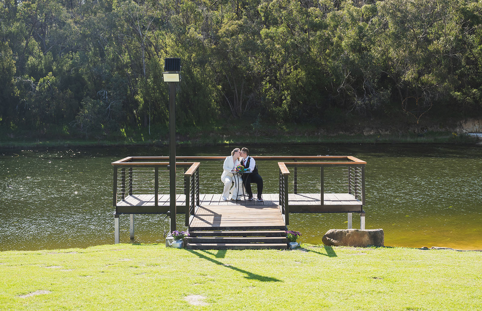 tiny house on the prairie wedding - kat & stacey 93 bridal couple on platform