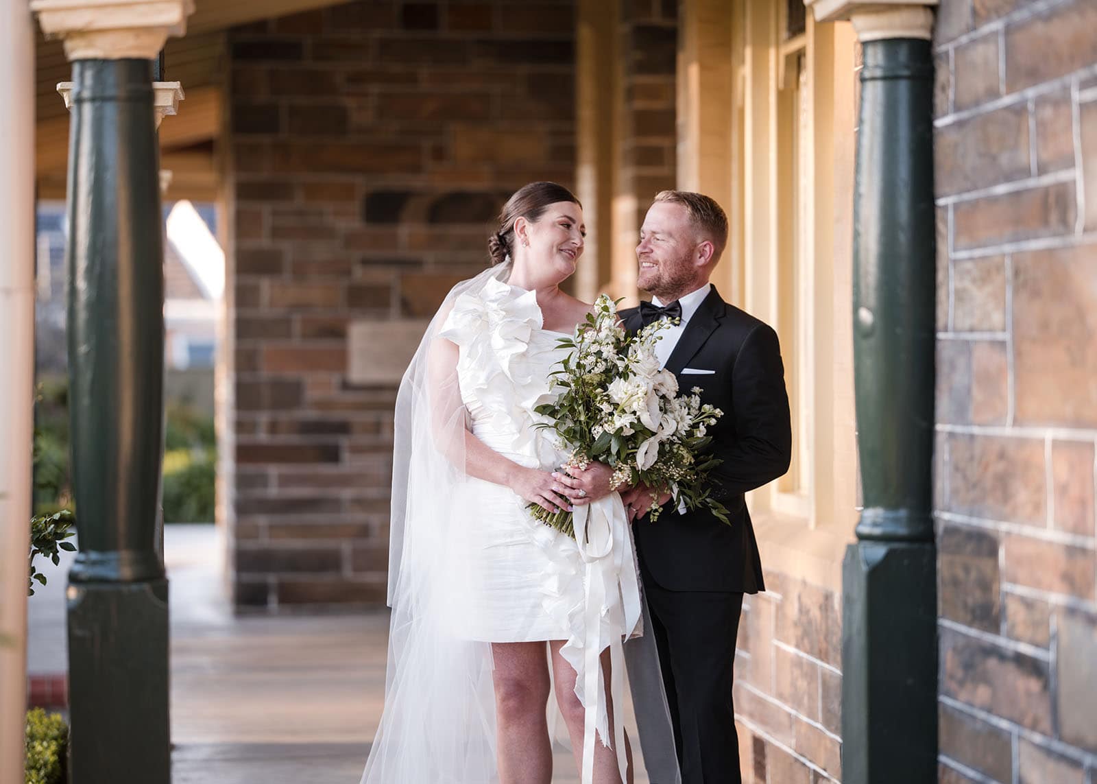 glenelg's partridge house wedding - emma & steven 156 Bride and groom embrace on porch