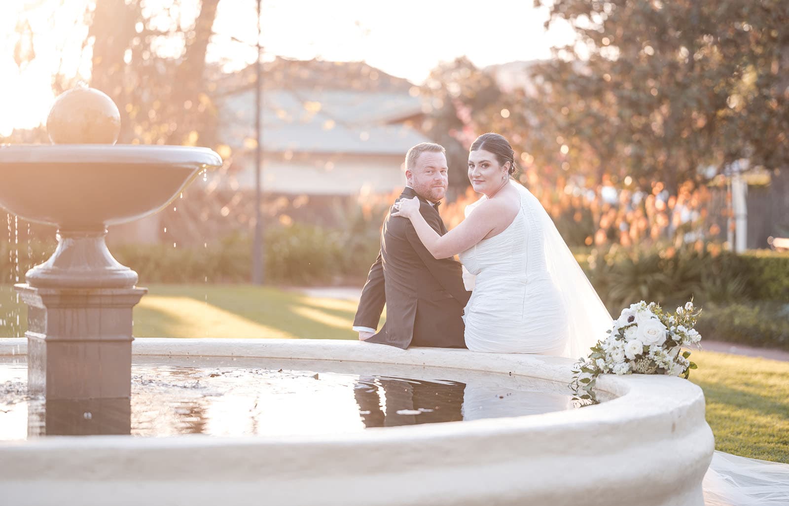 glenelg's partridge house wedding - emma & steven 158 Bride and groom on edge of fountain