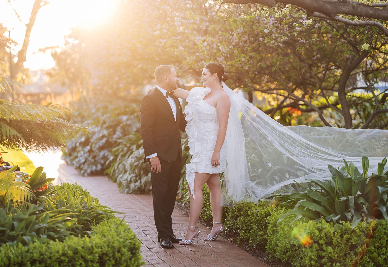 glenelg's partridge house wedding - emma & steven 160 Bride and groom under sunlight